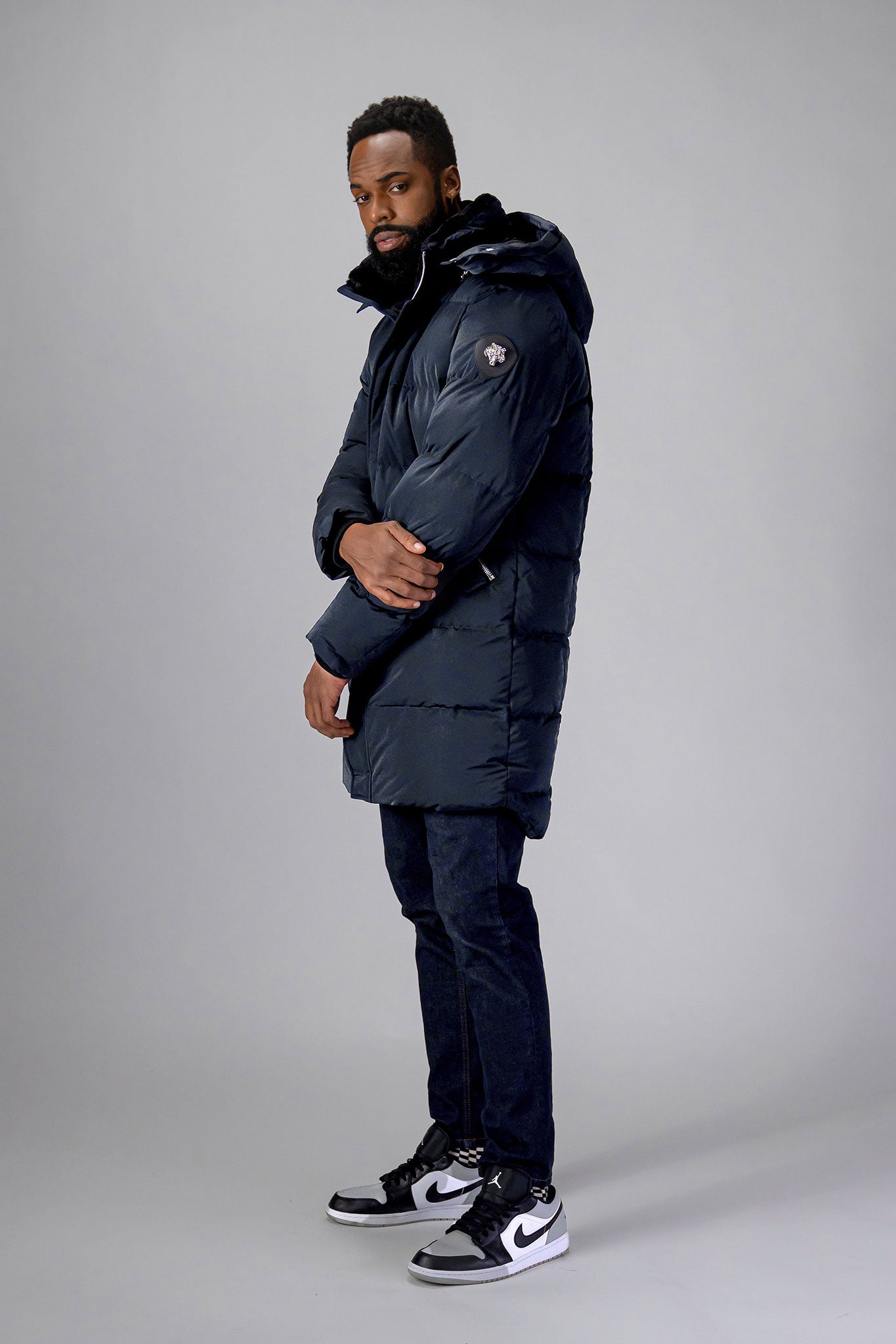 Woodpecker Men's Penguin Long Winter coat. High-end Canadian designer winter coat for men in "Blue Diamond" colour. Woodpecker cruelty-free winter coat designed in Canada. Men's heavy weight long length premium designer jacket for winter. Superior quality warm winter coat for men. Moose Knuckles, Canada Goose, Mackage, Montcler, Will Poho, Willbird, Nic Bayley. Extra warm. Shiny parka. Stylish winter jacket. Designer winter coat.