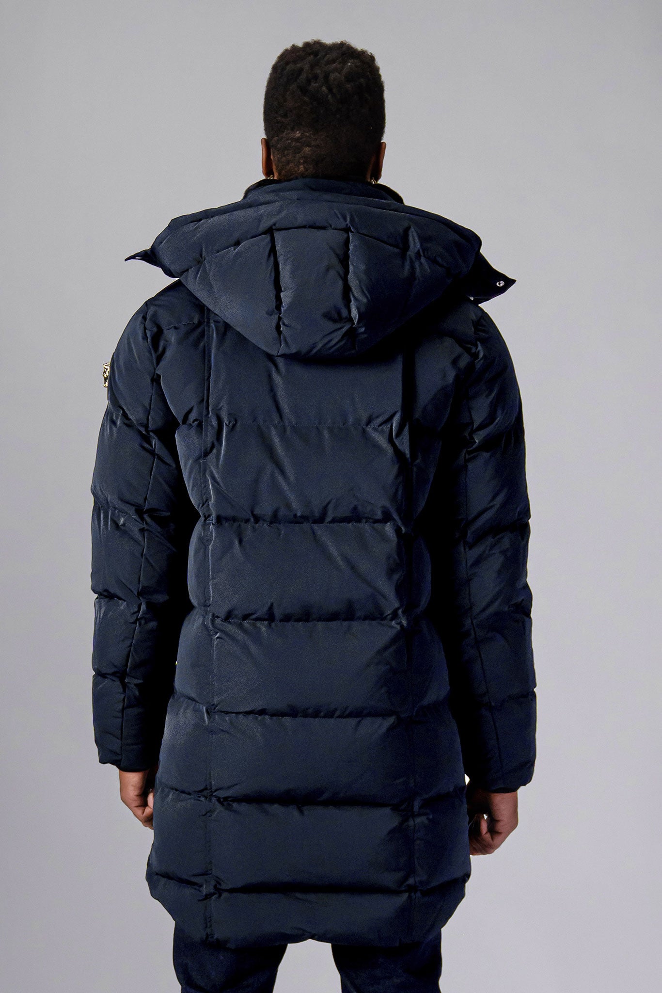 Woodpecker Men's Penguin Long Winter coat. High-end Canadian designer winter coat for men in "Blue Diamond" colour. Woodpecker cruelty-free winter coat designed in Canada. Men's heavy weight long length premium designer jacket for winter. Superior quality warm winter coat for men. Moose Knuckles, Canada Goose, Mackage, Montcler, Will Poho, Willbird, Nic Bayley. Extra warm. Shiny parka. Stylish winter jacket. Designer winter coat.