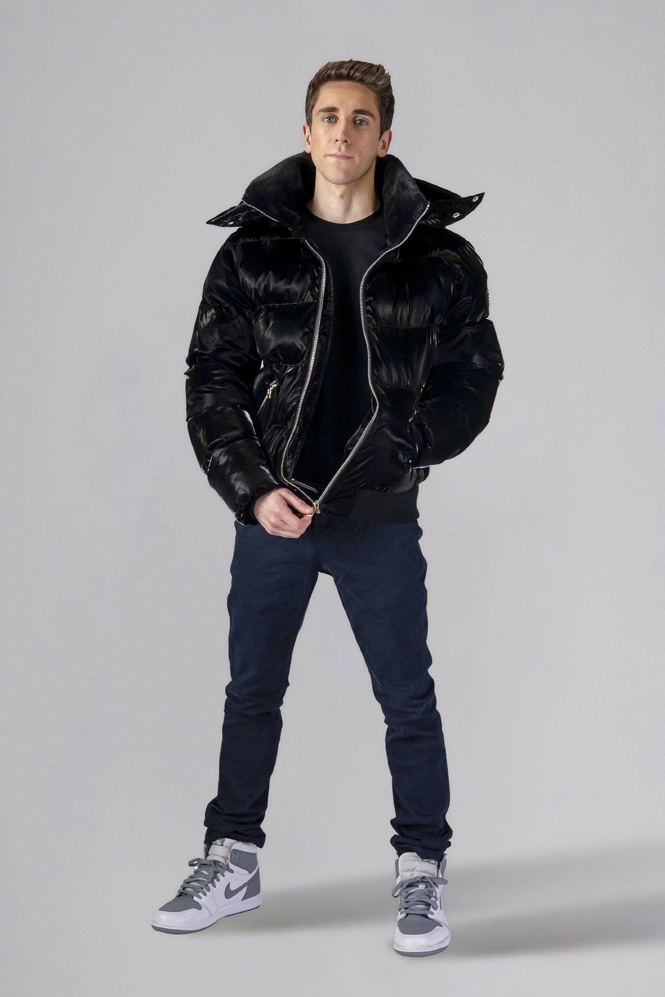 Woodpecker Men's Woody Bomber Winter coat. High-end Canadian designer winter coat for men in shiny “All Wet Black" colour. Woodpecker cruelty-free winter coat designed in Canada. Men's heavy weight short length premium designer jacket for winter. Superior quality warm winter coat for men. Moose Knuckles, Canada Goose, Mackage, Montcler, Will Poho, Willbird, Nic Bayley. Shiny parka. Stylish winter jacket. Designer winter coat.