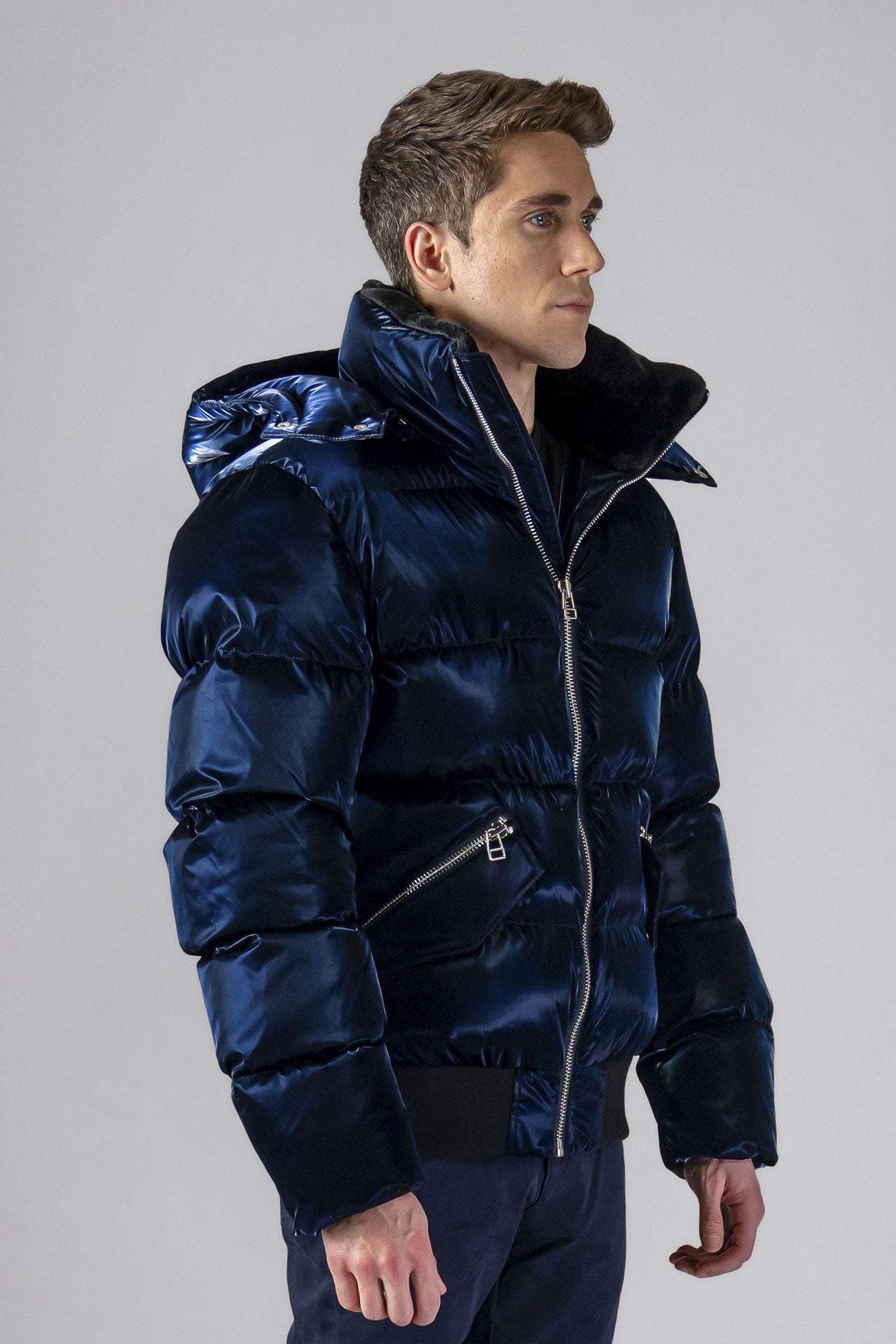 Woodpecker Men's Woody Bomber Winter coat. High-end Canadian designer winter coat for men in shiny “All Wet Navy" colour. Woodpecker cruelty-free winter coat designed in Canada. Men's heavy weight short length premium designer jacket for winter. Superior quality warm winter coat for men. Moose Knuckles, Canada Goose, Mackage, Montcler, Will Poho, Willbird, Nic Bayley. Shiny parka. Stylish winter jacket. Designer winter coat.