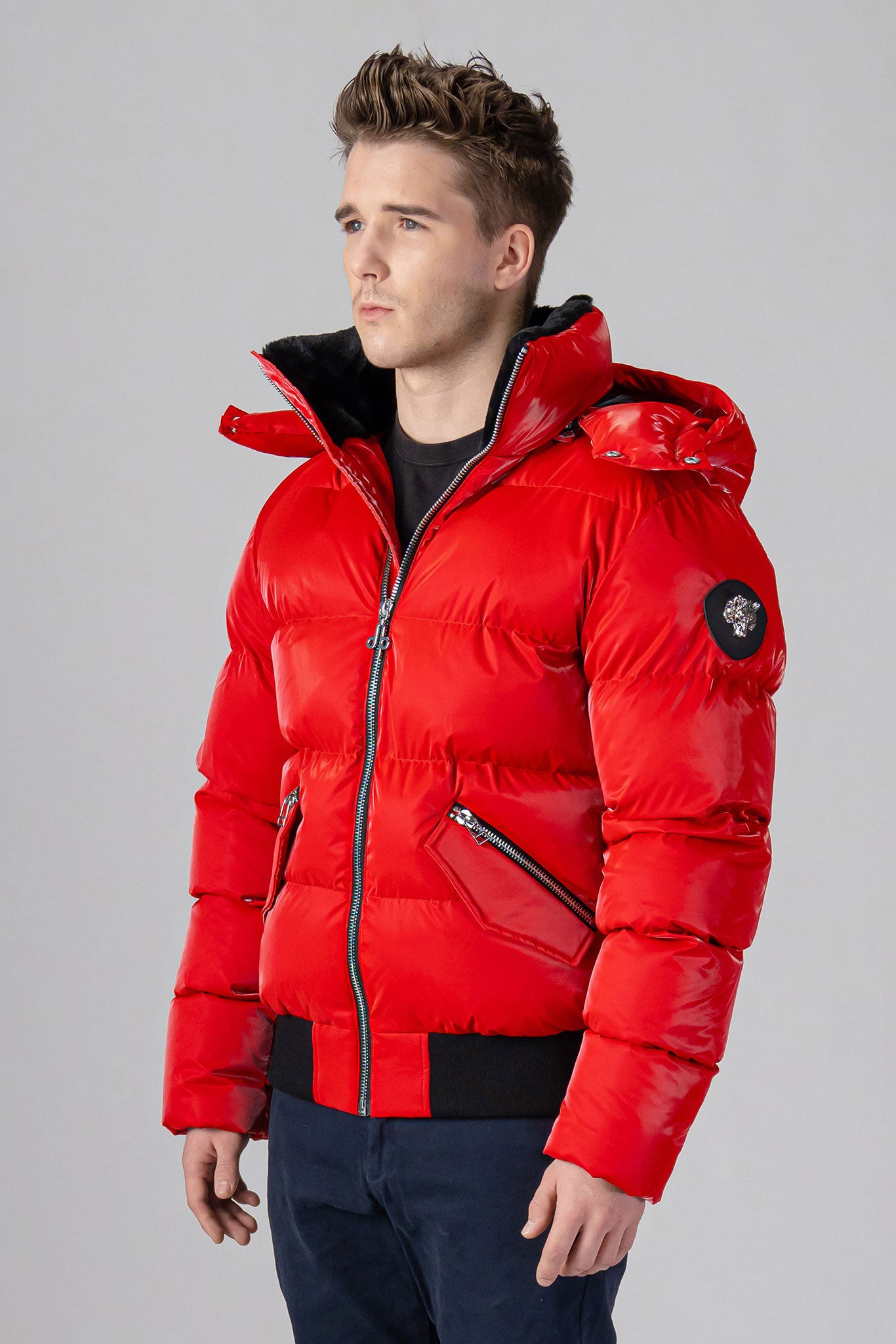 Woodpecker Men's Woody Bomber Winter coat. High-end Canadian designer winter coat for men in “Fashion Santa" colour. Woodpecker cruelty-free winter coat designed in Canada. Men's heavy weight short length premium designer jacket for winter. Superior quality warm winter coat for men. Moose Knuckles, Canada Goose, Mackage, Montcler, Will Poho, Willbird, Nic Bayley. Shiny parka. Stylish winter jacket. Designer winter coat.