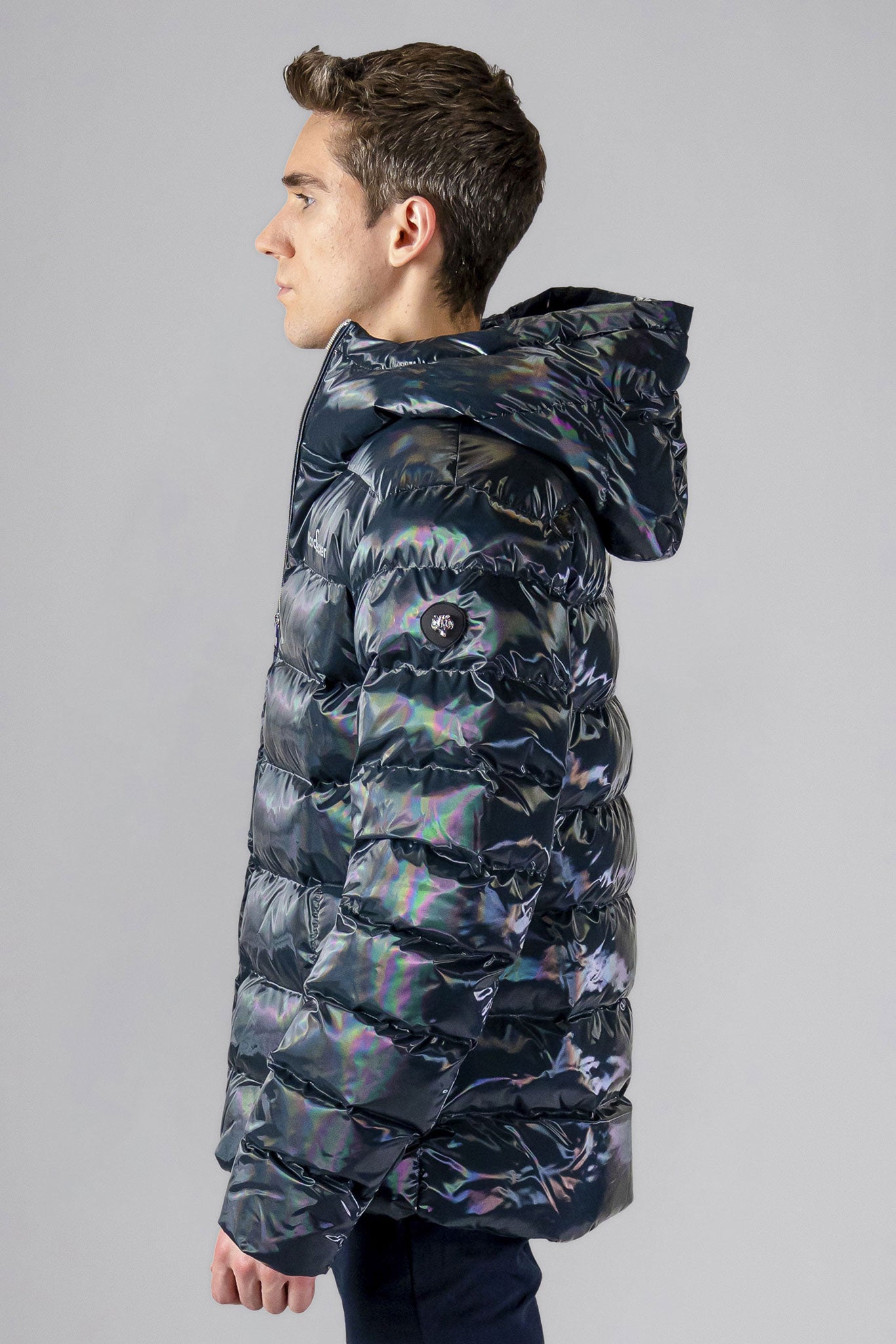 High-end Canadian designer winter coat for men in "Raven Black" colour. Woodpecker cruelty-free winter coat designed in Canada. Men's medium weight medium length premium designer jacket for winter. Superior quality warm winter coat for men. Moose Knuckles, Canada Goose, Mackage, Montcler, Will Poho, Willbird, Nic Bayley. Shiny parka. Stylish winter jacket. Designer winter coat.