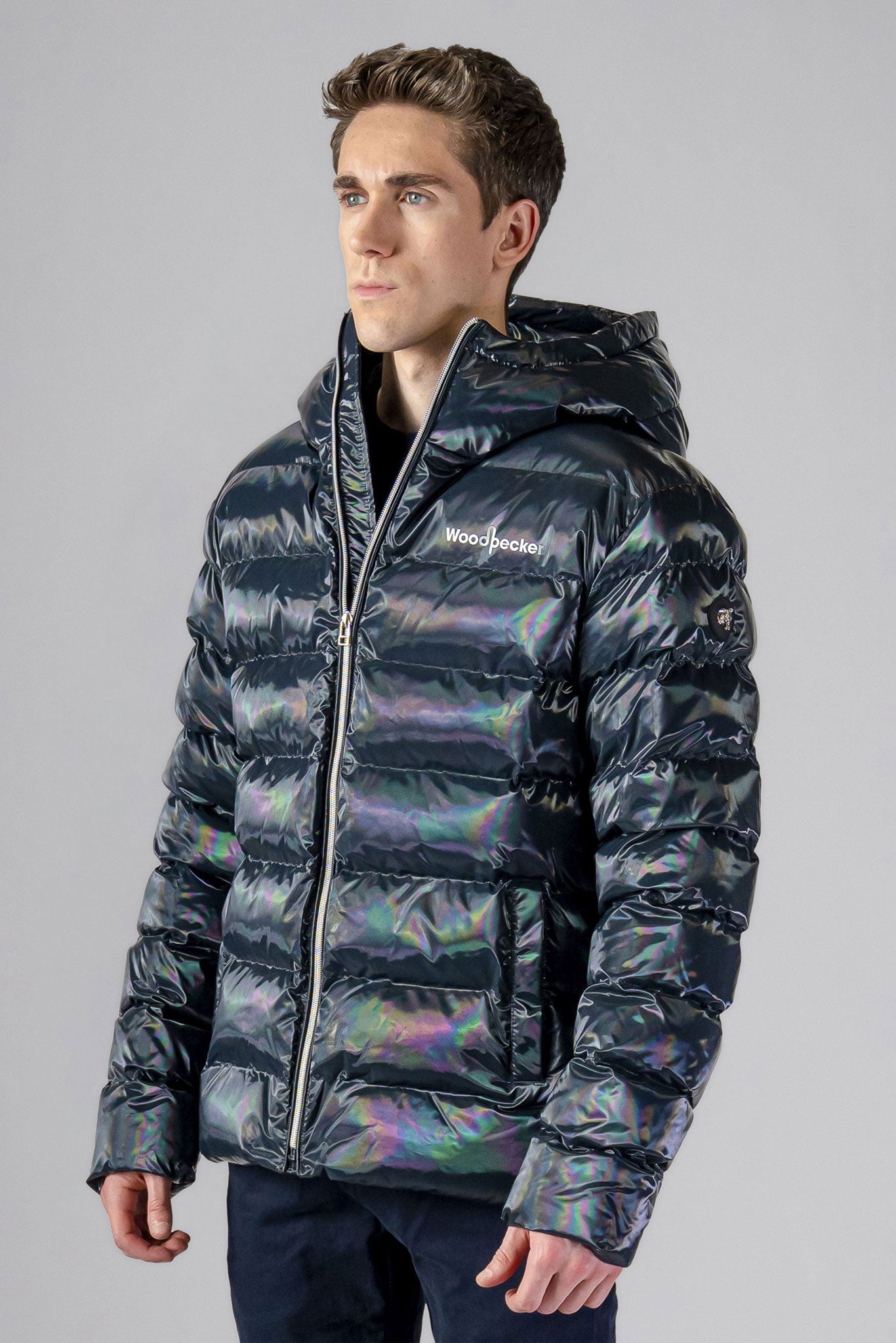 High-end Canadian designer winter coat for men in "Raven Black" colour. Woodpecker cruelty-free winter coat designed in Canada. Men's medium weight medium length premium designer jacket for winter. Superior quality warm winter coat for men. Moose Knuckles, Canada Goose, Mackage, Montcler, Will Poho, Willbird, Nic Bayley. Shiny parka. Stylish winter jacket. Designer winter coat.