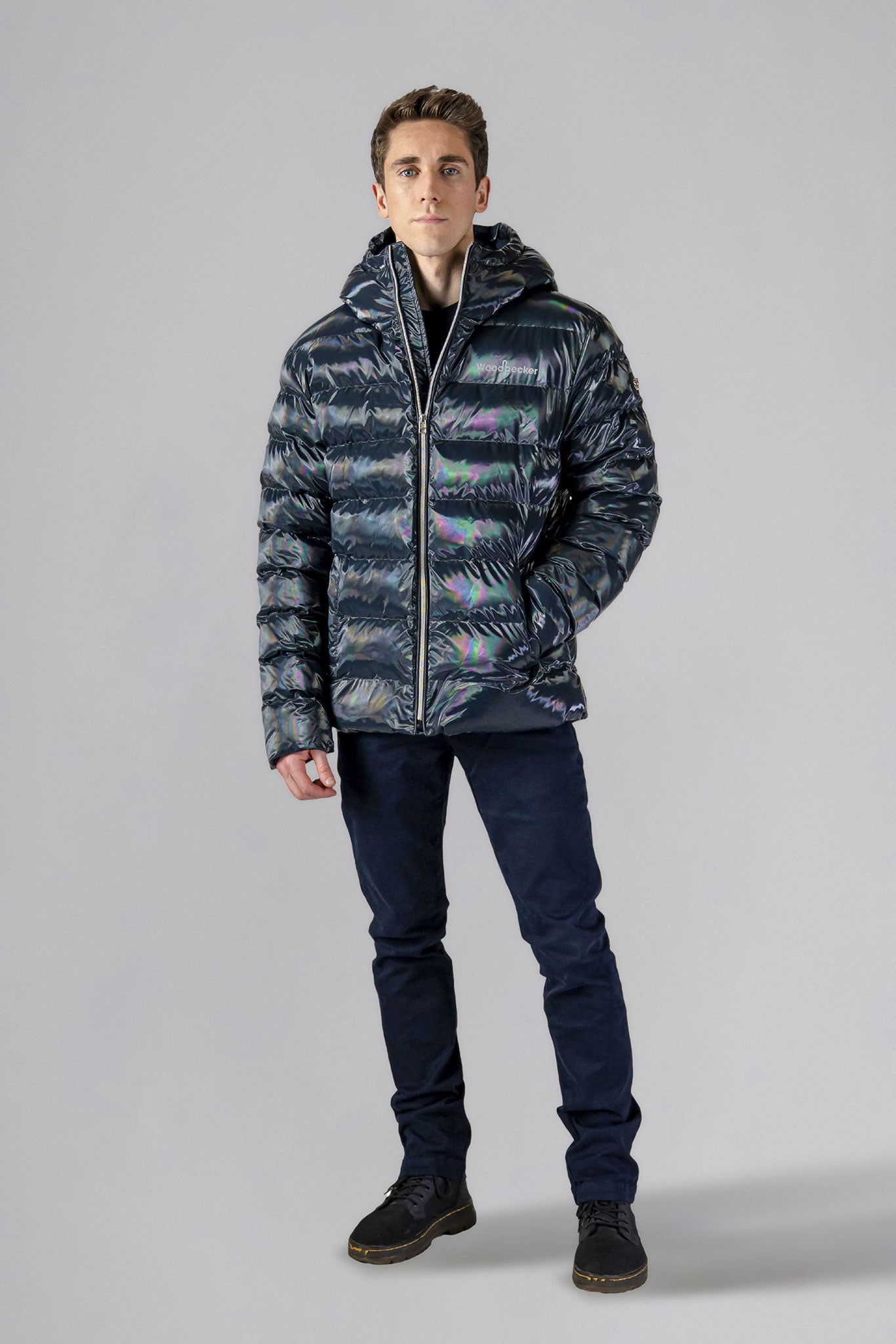 High-end Canadian designer winter coat for men in "Raven Black" colour. Woodpecker cruelty-free winter coat designed in Canada. Men's medium weight medium length premium designer jacket for winter. Superior quality warm winter coat for men. Moose Knuckles, Canada Goose, Mackage, Montcler, Will Poho, Willbird, Nic Bayley. Shiny parka. Stylish winter jacket. Designer winter coat.