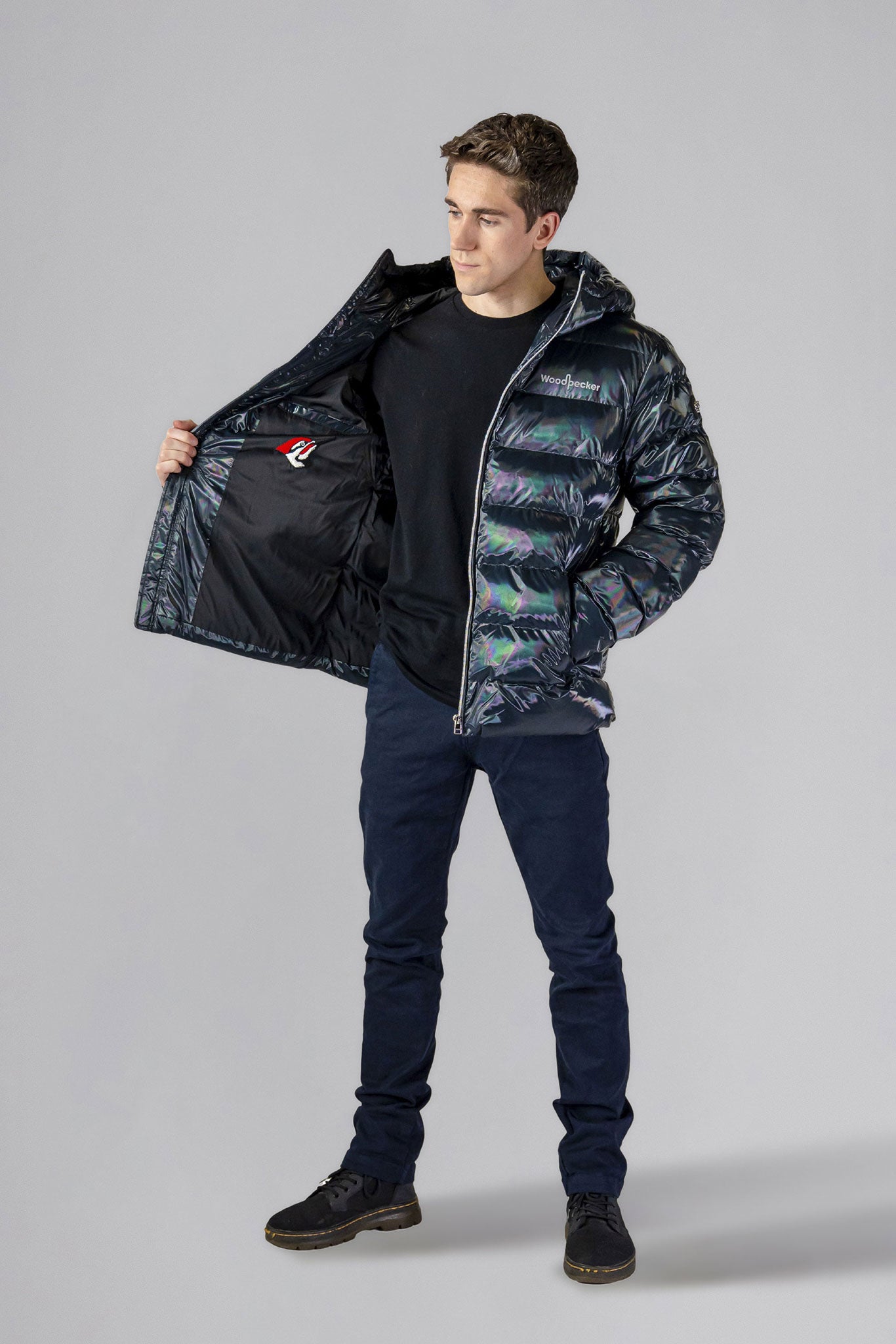 High-end Canadian designer winter coat for men in "Raven Black" colour. Woodpecker cruelty-free winter coat designed in Canada. Men's medium weight medium length premium designer jacket for winter. Superior quality warm winter coat for men. Moose Knuckles, Canada Goose, Mackage, Montcler, Will Poho, Willbird, Nic Bayley. Shiny parka. Stylish winter jacket. Designer winter coat.