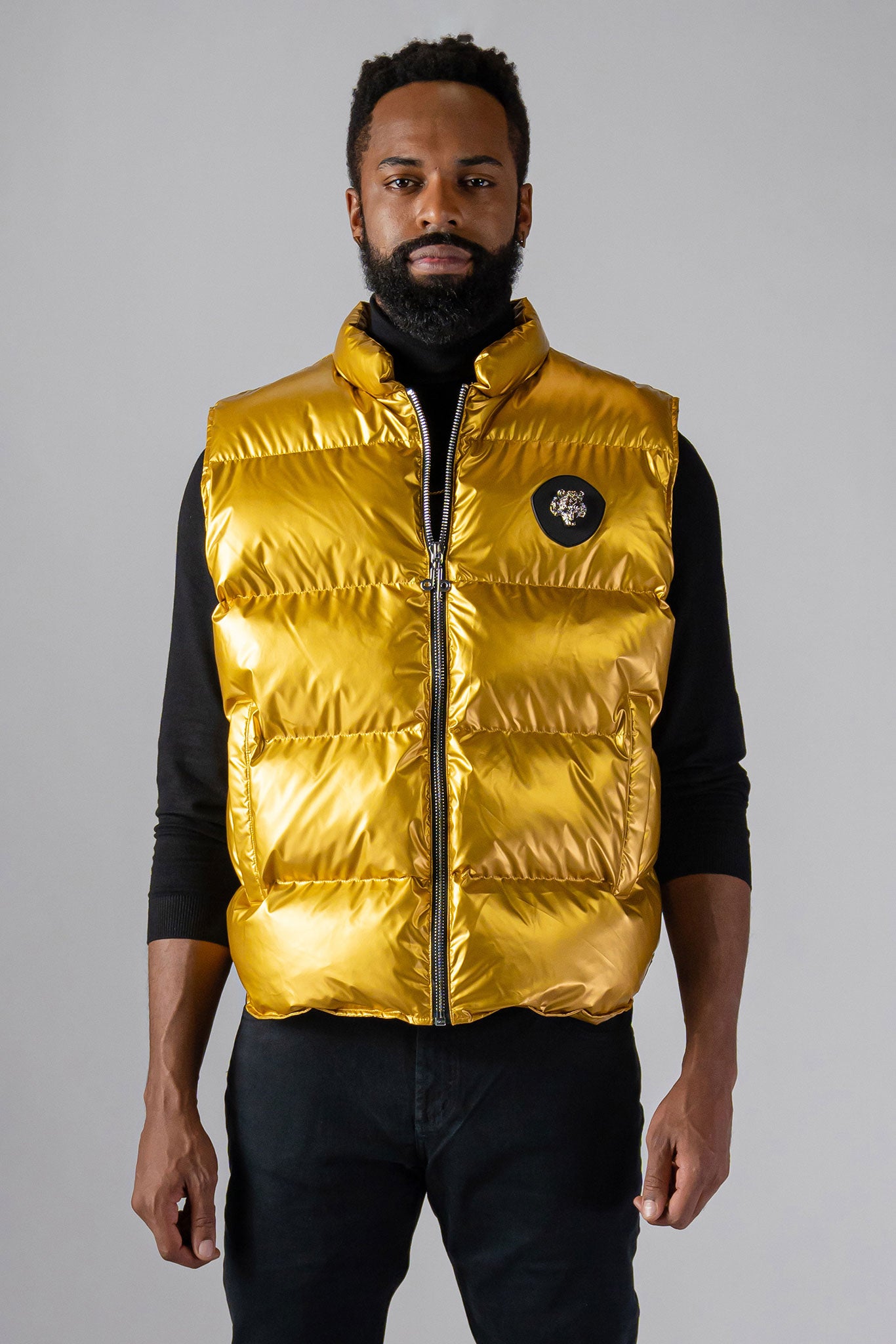Woodpecker Unisex Winter Vest. High-end Canadian designer winter vest in "Gold" colour. Woodpecker cruelty-free vest designed in Canada. Heavy weight short length premium designer vest for winter. Superior quality warm winter vest. Moose Knuckles, Canada Goose, Mackage, Montcler, Will Poho, Willbird, Nic Bayley. Extra warm. Shiny vest. Stylish winter vest. Designer winter vest.