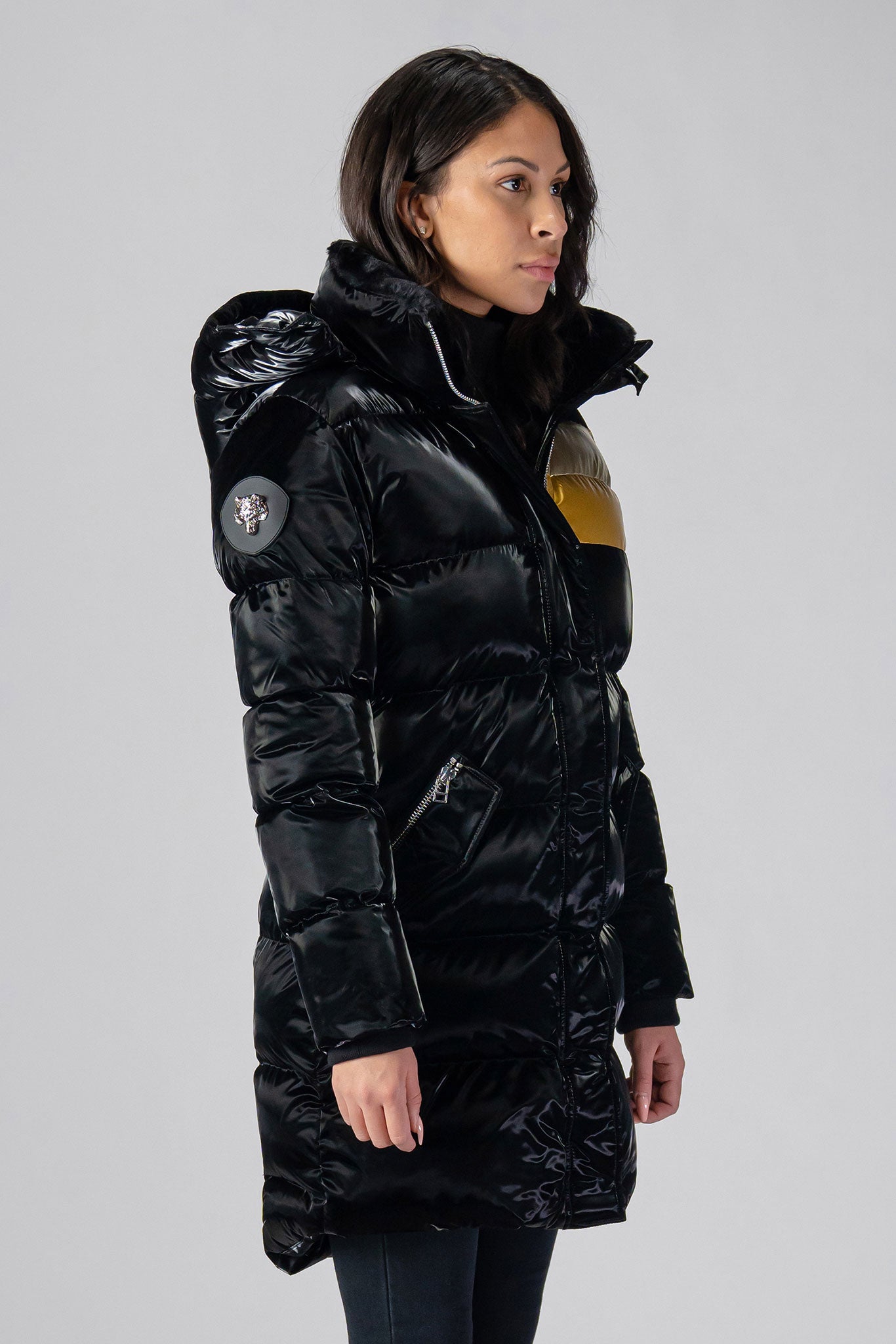 Woodpecker Women's Penguin Long Winter coat. High-end Canadian designer winter coat for women in "Firebird" colour. Woodpecker cruelty-free winter coat designed in Canada. Women's heavy weight long length premium designer jacket for winter. Superior quality warm winter coat for women. Moose Knuckles, Canada Goose, Mackage, Montcler, Will Poho, Willbird, Nic Bayley. Extra warm. Shiny parka. Stylish winter jacket. Designer winter coat.
