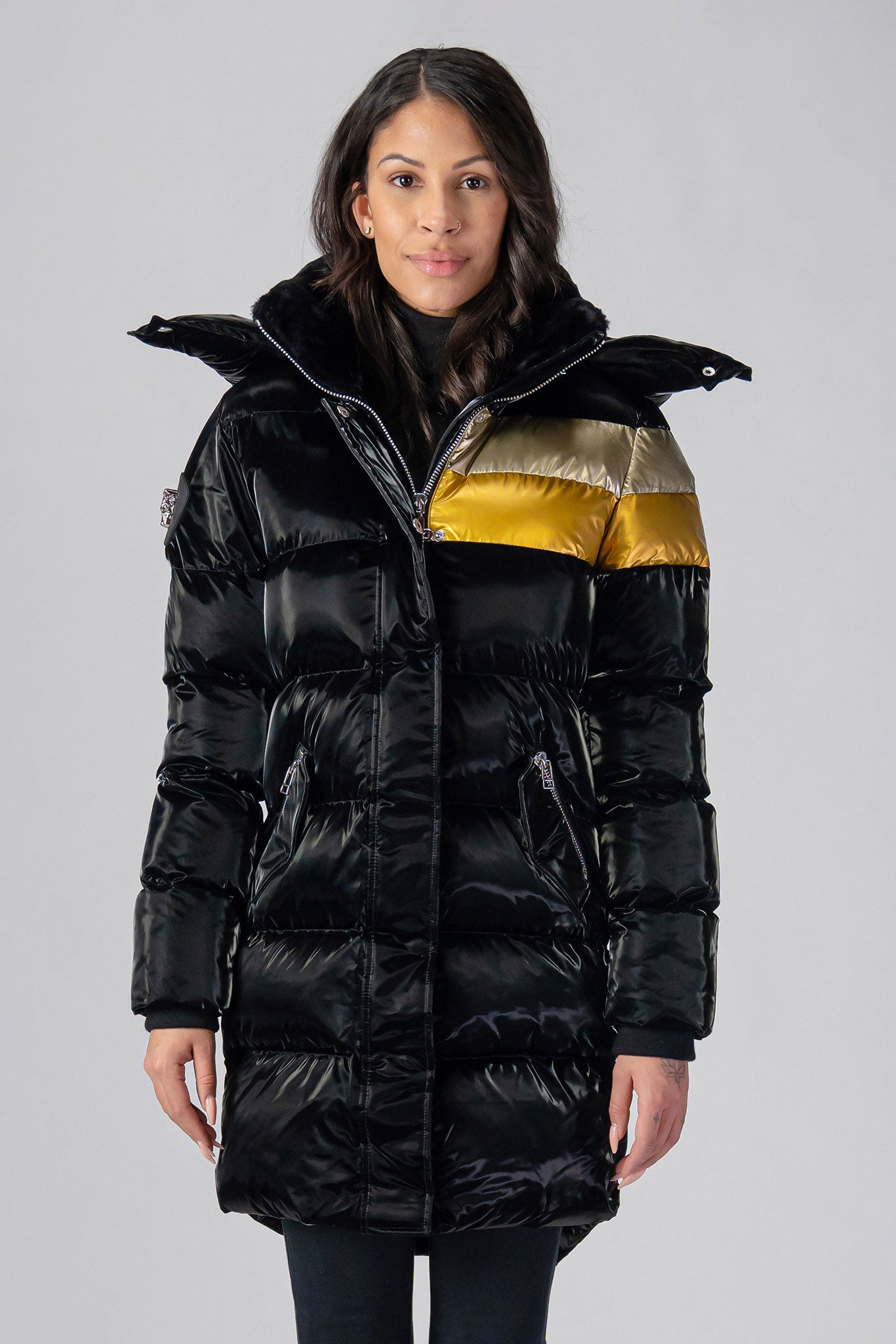 Woodpecker Women's Penguin Long Winter coat. High-end Canadian designer winter coat for women in "Firebird" colour. Woodpecker cruelty-free winter coat designed in Canada. Women's heavy weight long length premium designer jacket for winter. Superior quality warm winter coat for women. Moose Knuckles, Canada Goose, Mackage, Montcler, Will Poho, Willbird, Nic Bayley. Extra warm. Shiny parka. Stylish winter jacket. Designer winter coat.