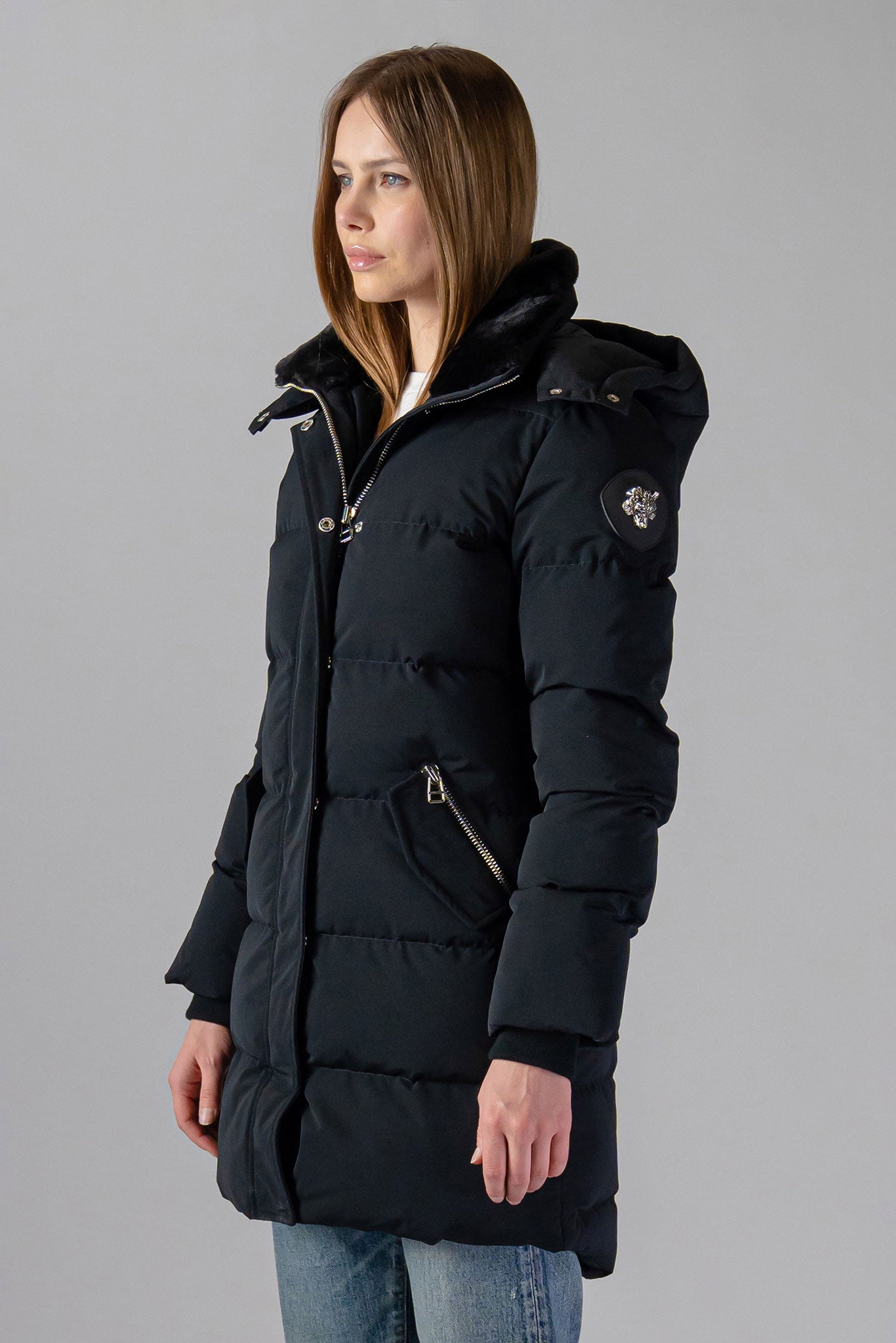 Woodpecker Women's Penguin Long Winter coat. High-end Canadian designer winter coat for women in "Matte Black" colour. Woodpecker cruelty-free winter coat designed in Canada. Women's heavy weight long length premium designer jacket for winter. Superior quality warm winter coat for women. Moose Knuckles, Canada Goose, Mackage, Montcler, Will Poho, Willbird, Nic Bayley. Extra warm. Shiny parka. Stylish winter jacket. Designer winter coat.