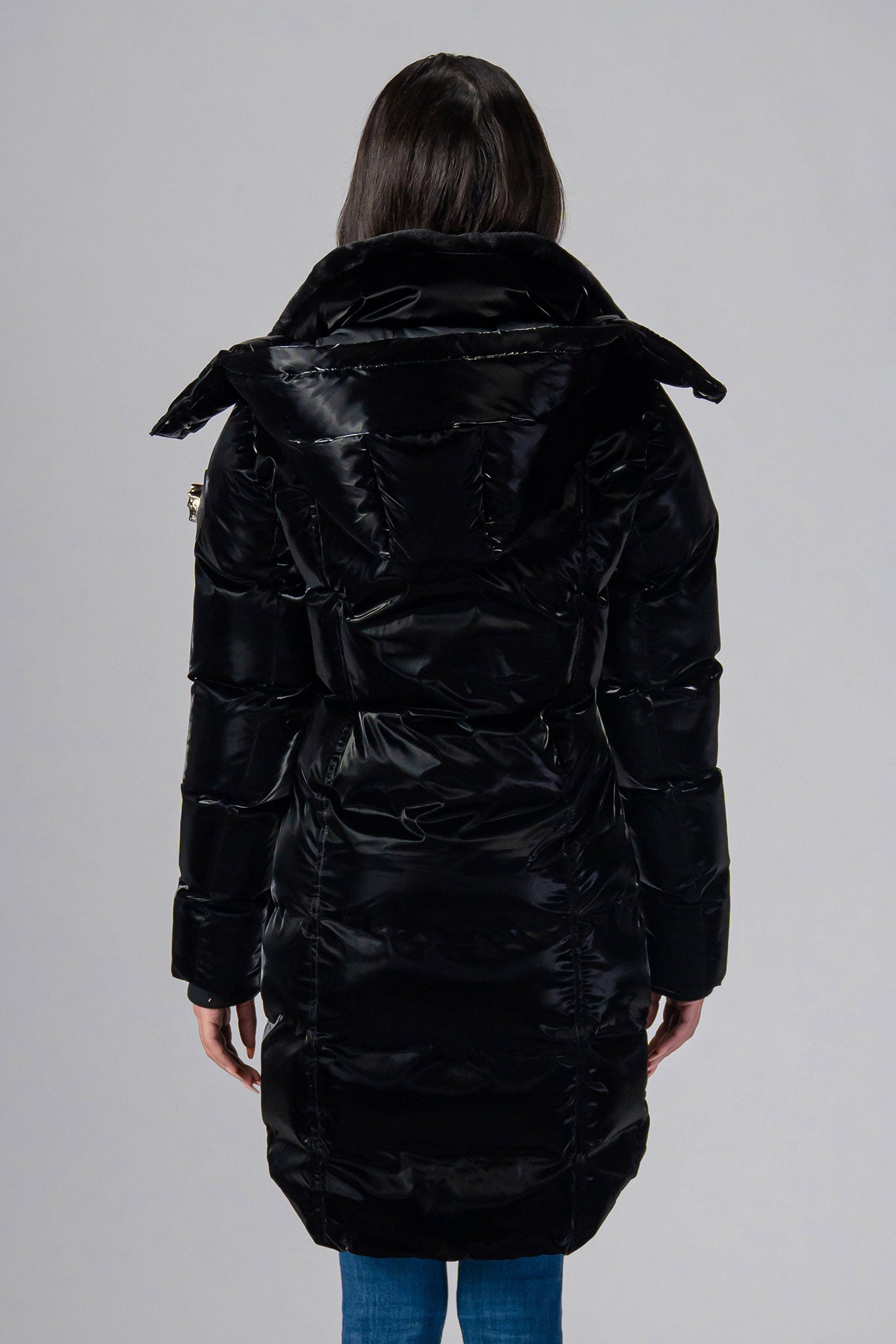 Woodpecker Women's Unquilted Penguin Long Winter coat. High-end Canadian designer winter coat for women in "All Wet Black" colour. Woodpecker cruelty-free winter coat designed in Canada. Women's heavy weight long length premium designer jacket for winter. Superior quality warm winter coat for women. Moose Knuckles, Canada Goose, Mackage, Montcler, Will Poho, Willbird, Nic Bayley. Extra warm. Shiny parka. Stylish winter jacket. Designer winter coat.