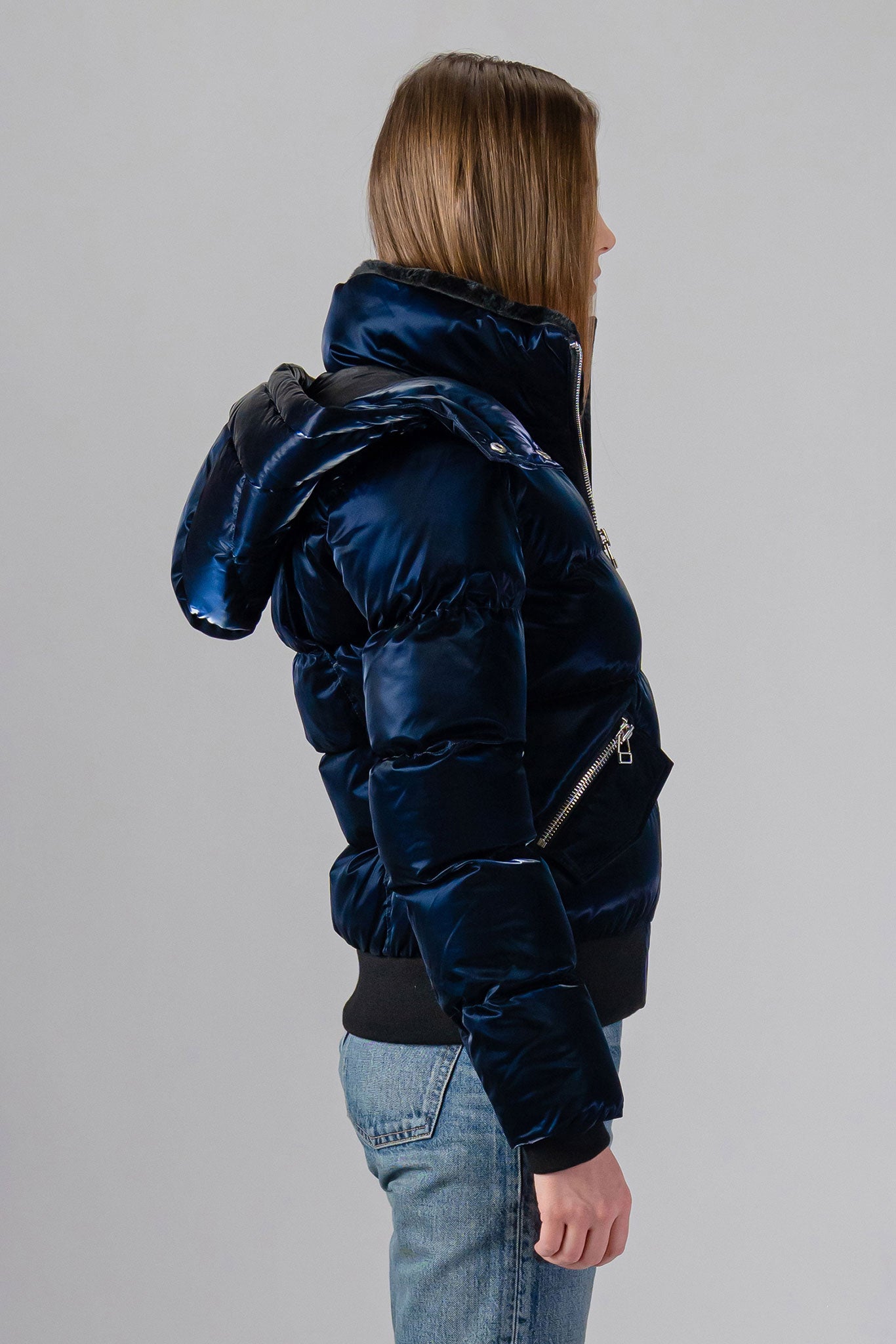 Woodpecker Women's Woody Bomber Winter coat. High-end Canadian designer winter coat for women in shiny “All Wet Navy". Woodpecker cruelty-free winter coat designed in Canada. Women's heavy weight short length premium designer jacket for winter. Superior quality warm winter coat for women. Moose Knuckles, Canada Goose, Mackage, Montcler, Will Poho, Willbird, Nic Bayley. Shiny parka. Stylish winter jacket. Designer winter coat.