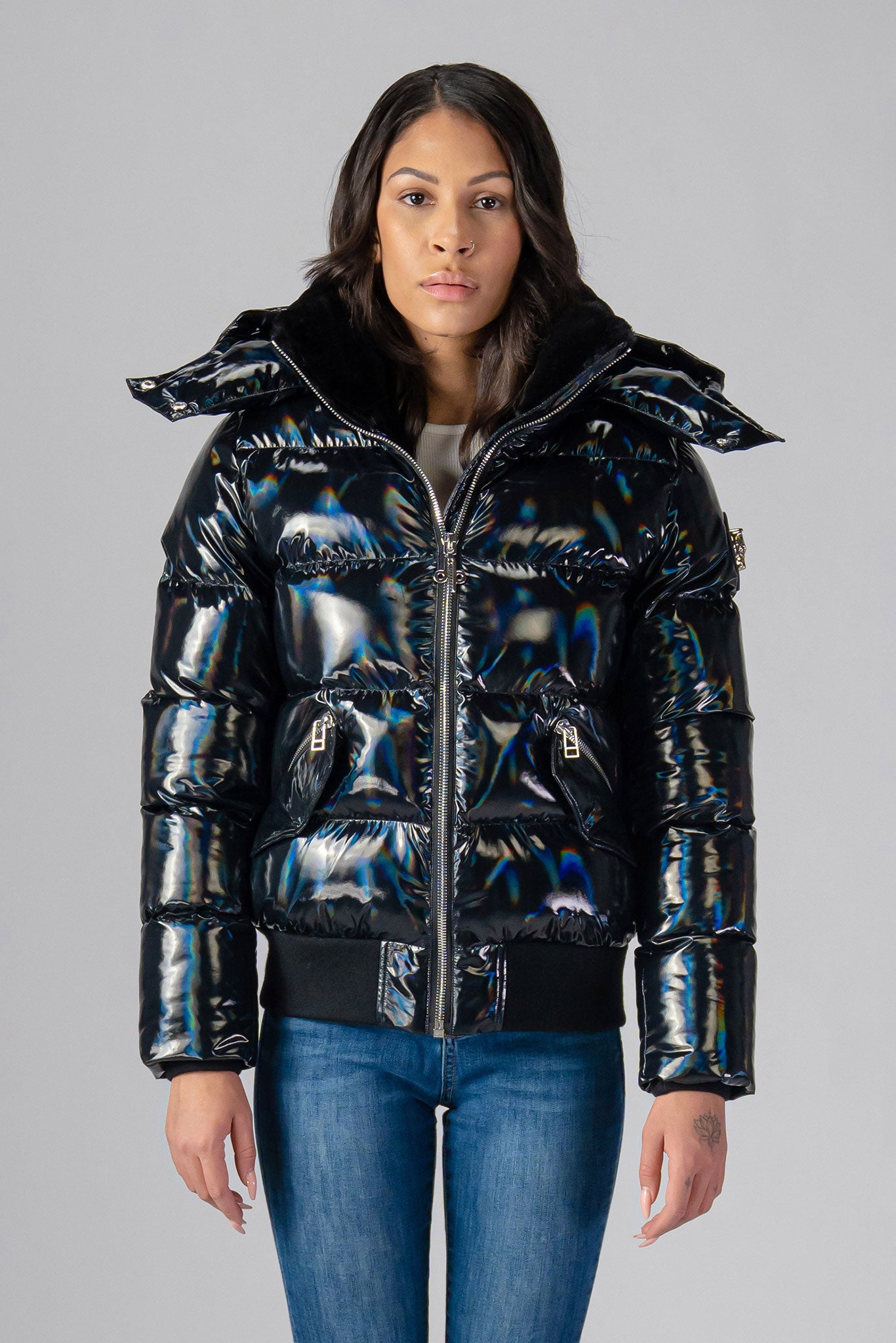 Woodpecker Women's Woody Bomber Winter coat. High-end Canadian designer winter coat for women in "Oily Black" colour. Woodpecker cruelty-free winter coat designed in Canada. Women's heavy weight short length premium designer jacket for winter. Superior quality warm winter coat for women. Moose Knuckles, Canada Goose, Mackage, Montcler, Will Poho, Willbird, Nic Bayley. Shiny parka. Stylish winter jacket. Designer winter coat.