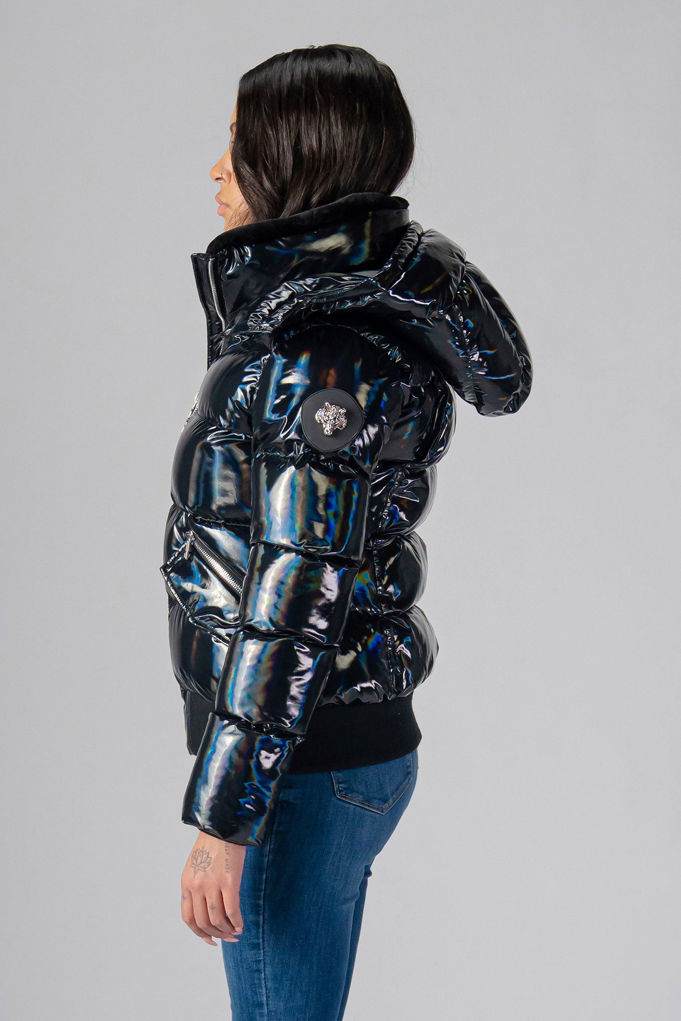 Woodpecker Women's Woody Bomber Winter coat. High-end Canadian designer winter coat for women in "Oily Black" colour. Woodpecker cruelty-free winter coat designed in Canada. Women's heavy weight short length premium designer jacket for winter. Superior quality warm winter coat for women. Moose Knuckles, Canada Goose, Mackage, Montcler, Will Poho, Willbird, Nic Bayley. Shiny parka. Stylish winter jacket. Designer winter coat.