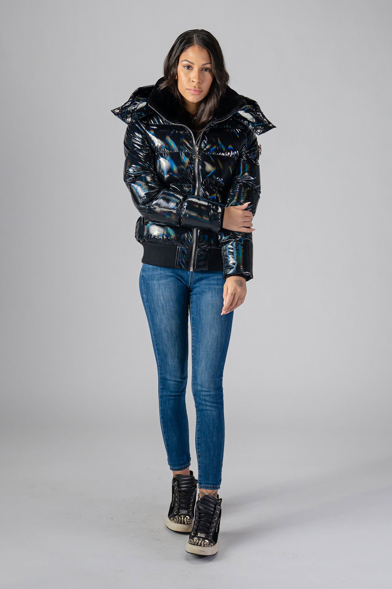 Woodpecker Women's Woody Bomber Winter coat. High-end Canadian designer winter coat for women in "Oily Black" colour. Woodpecker cruelty-free winter coat designed in Canada. Women's heavy weight short length premium designer jacket for winter. Superior quality warm winter coat for women. Moose Knuckles, Canada Goose, Mackage, Montcler, Will Poho, Willbird, Nic Bayley. Shiny parka. Stylish winter jacket. Designer winter coat.