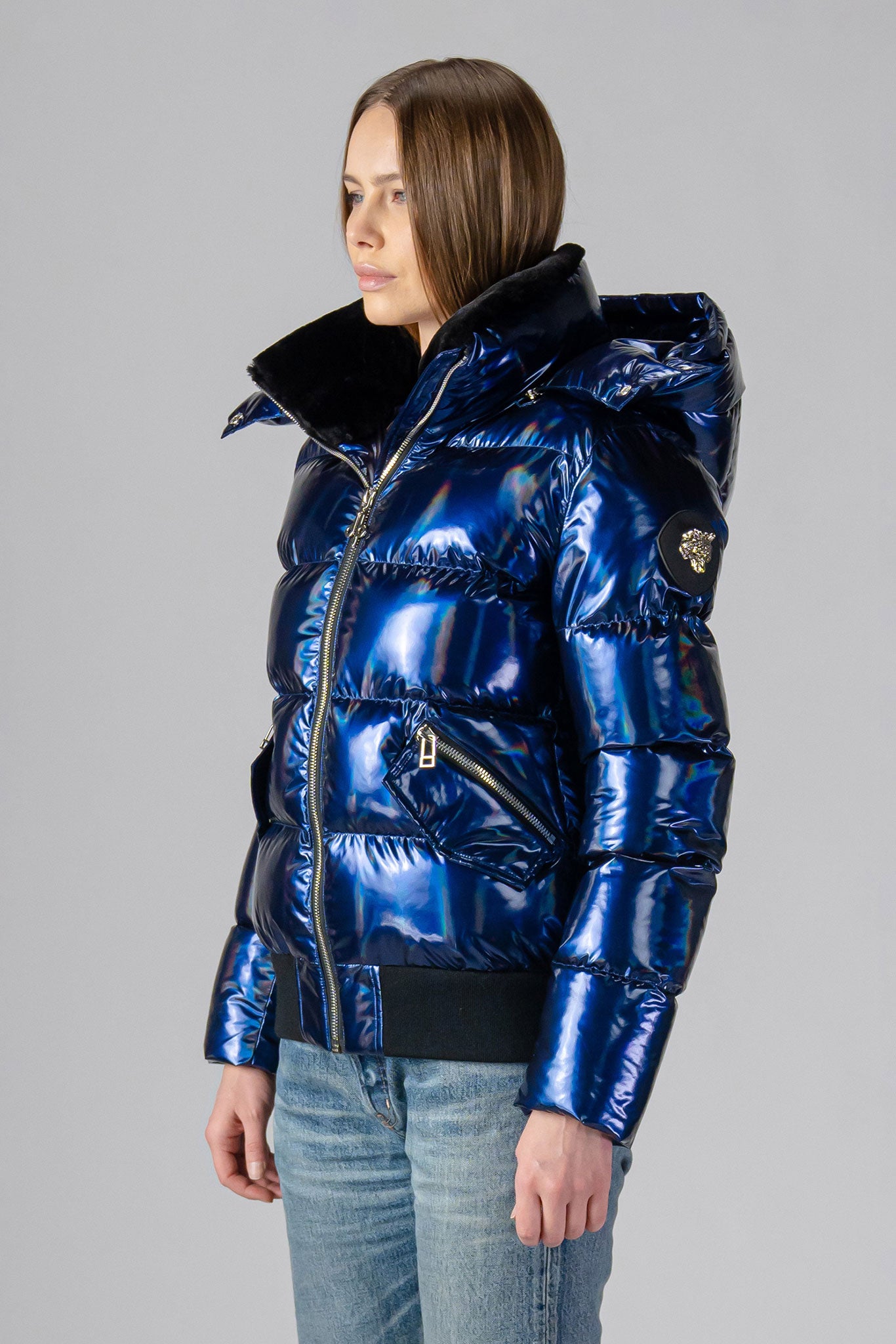 coat. High-end Canadian designer winter coat for women in "Oily Blue" colour. Woodpecker cruelty-free winter coat designed in Canada. Women's heavy weight short length premium designer jacket for winter. Superior quality warm winter coat for women. Moose Knuckles, Canada Goose, Mackage, Montcler, Will Poho, Willbird, Nic Bayley. Shiny parka. Stylish winter jacket. Designer winter coat.