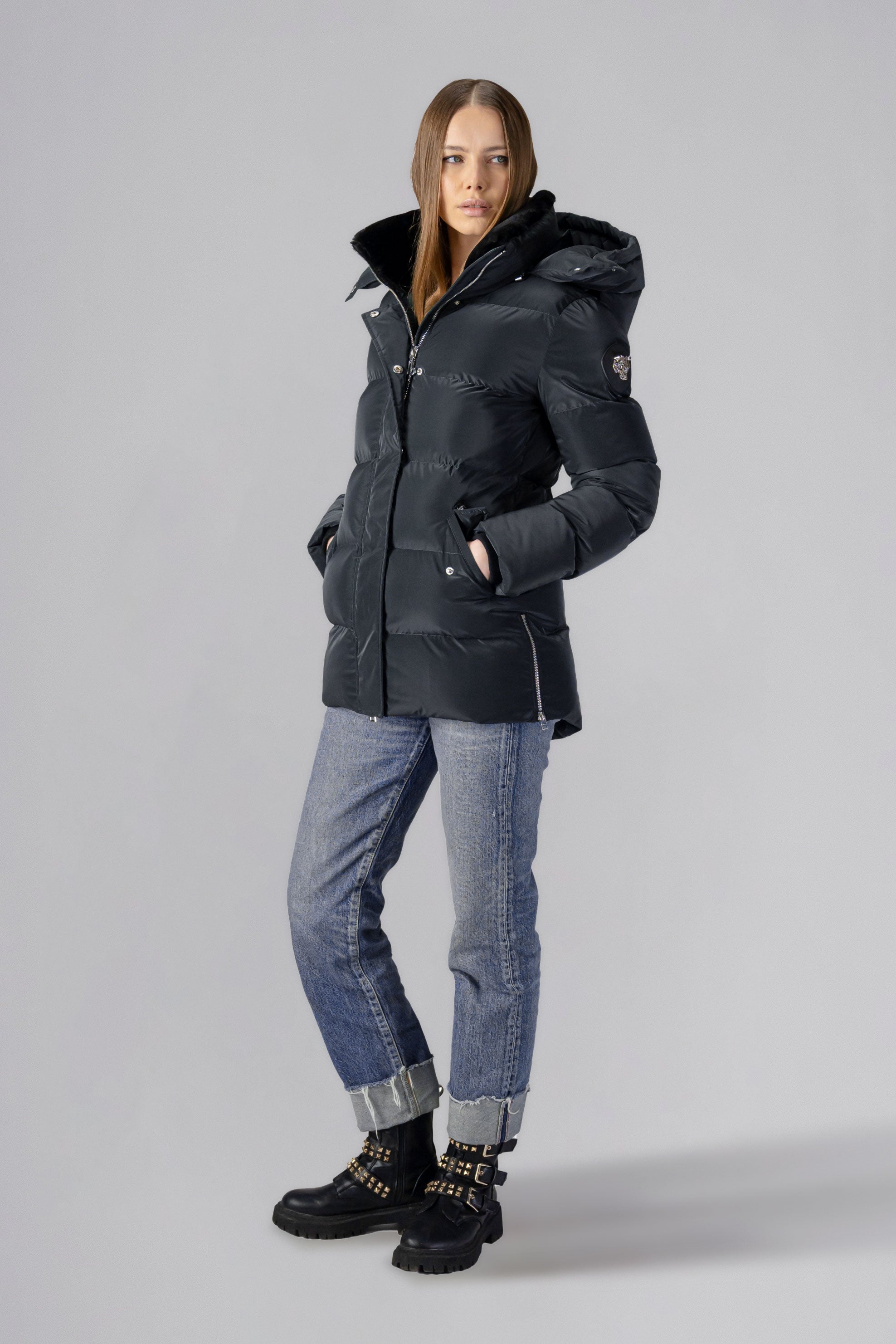Woodpecker Women's Bumnester Winter coat. High-end Canadian designer winter coat for women in shiny "Black Diamond" colour. Woodpecker cruelty-free winter coat designed in Canada. Women's heavy weight medium length premium designer jacket for winter. Superior quality warm winter coat for women. Moose Knuckles, Canada Goose, Mackage, Montcler, Will Poho, Willbird, Nic Bayley. Extra warm. Shiny parka. Stylish winter jacket. Designer winter coat.