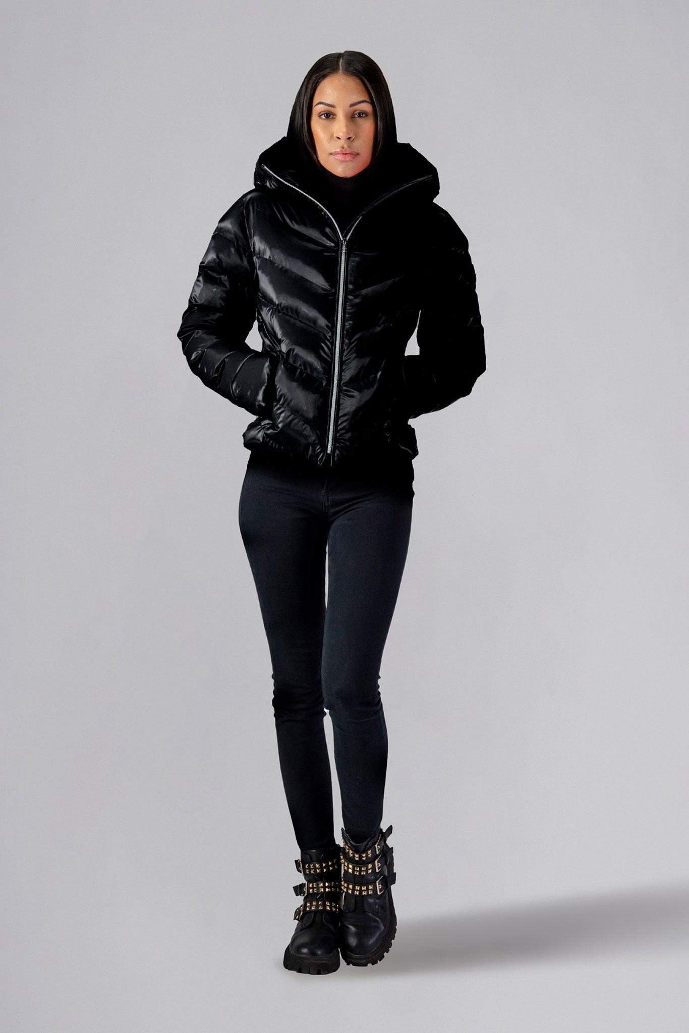 Woodpecker Women's Robin Winter coat. High-end Canadian designer winter coat for women in "All Wet Black" colour. Woodpecker cruelty-free winter coat designed in Canada. Women's medium weight medium length premium designer jacket for winter. Superior quality warm winter coat for women. Moose Knuckles, Canada Goose, Mackage, Montcler, Will Poho, Willbird, Nic Bayley. Extra warm. Shiny parka. Stylish winter jacket. Designer winter coat.