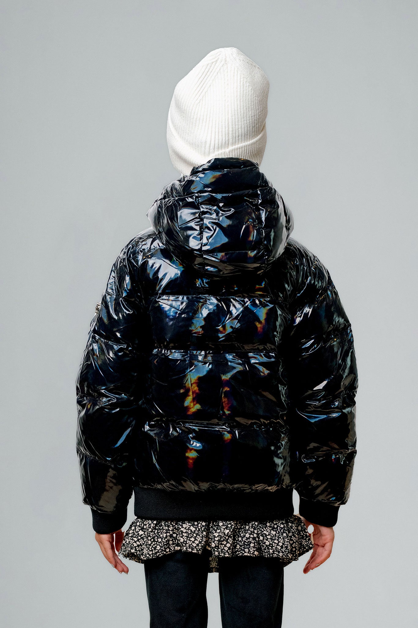 Woodpecker Kids' Chickadee Winter coat. High-end Canadian designer winter coat for Kids in "Oily Black" colour. Woodpecker cruelty-free winter coat designed in Canada. Kids' heavy weight short length premium designer jacket for winter. Superior quality warm winter coat for kids. Moose Knuckles, Canada Goose, Mackage, Montcler, Will Poho, Willbird, Nic Bayley. Extra Warm. Shiny parka. Stylish winter jacket. Designer winter coat.