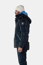 Load image into Gallery viewer, Woodpecker Men&#39;s Bumnester Bomber Winter coat. High-end Canadian designer winter coat for men in &quot;Blue Diamond&quot; colour. Woodpecker cruelty-free winter coat designed in Canada. Men&#39;s heavy weight medium length premium designer jacket for winter. Superior quality warm winter coat for men. Moose Knuckles, Canada Goose, Mackage, Montcler, Will Poho, Willbird, Nic Bayley. Shiny parka. Stylish winter jacket. Designer winter coat.
