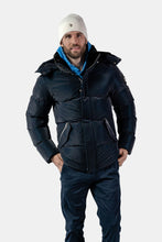 Load image into Gallery viewer, Woodpecker Men&#39;s Bumnester Bomber Winter coat. High-end Canadian designer winter coat for men in &quot;Blue Diamond&quot; colour. Woodpecker cruelty-free winter coat designed in Canada. Men&#39;s heavy weight medium length premium designer jacket for winter. Superior quality warm winter coat for men. Moose Knuckles, Canada Goose, Mackage, Montcler, Will Poho, Willbird, Nic Bayley. Shiny parka. Stylish winter jacket. Designer winter coat.
