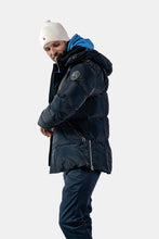 Load image into Gallery viewer, Woodpecker Men&#39;s Bumnester Bomber Winter coat. High-end Canadian designer winter coat for men in &quot;Blue Diamond&quot; colour. Woodpecker cruelty-free winter coat designed in Canada. Men&#39;s heavy weight medium length premium designer jacket for winter. Superior quality warm winter coat for men. Moose Knuckles, Canada Goose, Mackage, Montcler, Will Poho, Willbird, Nic Bayley. Shiny parka. Stylish winter jacket. Designer winter coat.
