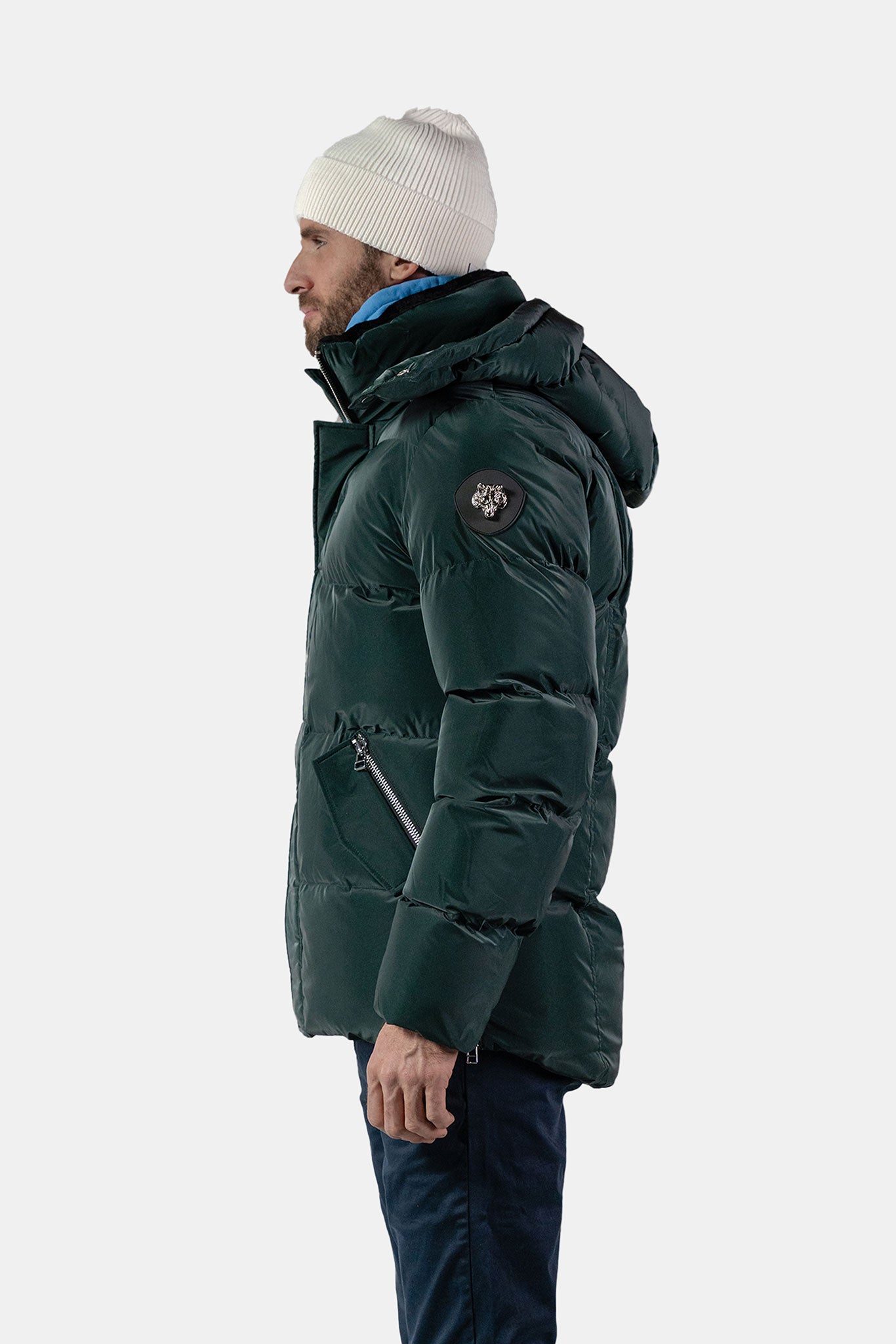 Woodpecker Men's Bumnester Bomber Winter coat. High-end Canadian designer winter coat for men in "Green Diamond" colour. Woodpecker cruelty-free winter coat designed in Canada. Men's heavy weight medium length premium designer jacket for winter. Superior quality warm winter coat for men. Moose Knuckles, Canada Goose, Mackage, Montcler, Will Poho, Willbird, Nic Bayley. Shiny parka. Stylish winter jacket. Designer winter coat.