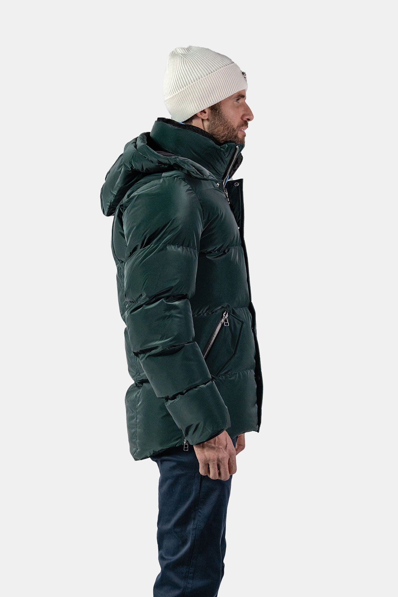 Woodpecker Men&#39;s Bumnester Bomber Winter coat. High-end Canadian designer winter coat for men in &quot;Green Diamond&quot; colour. Woodpecker cruelty-free winter coat designed in Canada. Men&#39;s heavy weight medium length premium designer jacket for winter. Superior quality warm winter coat for men. Moose Knuckles, Canada Goose, Mackage, Montcler, Will Poho, Willbird, Nic Bayley. Shiny parka. Stylish winter jacket. Designer winter coat.