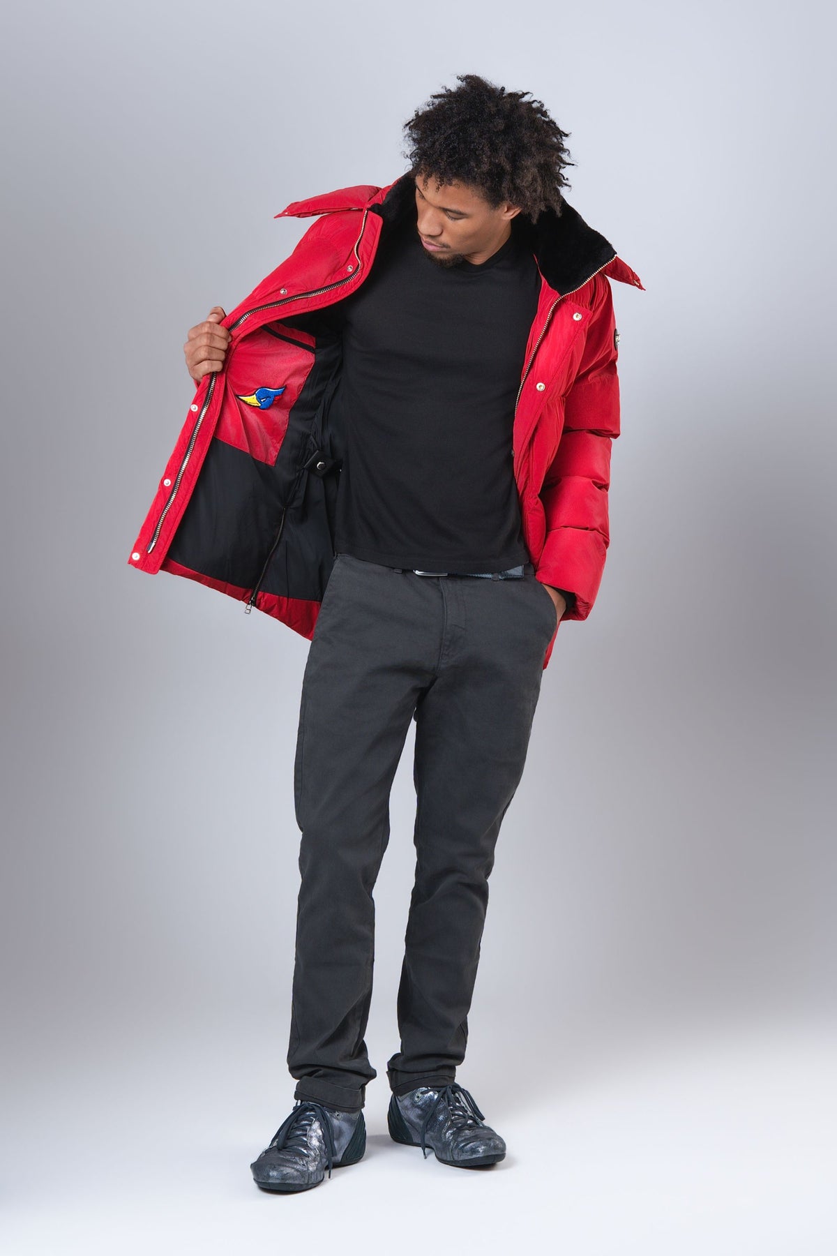 Interior lining patch on the men's Bumnester 3/4 winter coat in Red Diamond