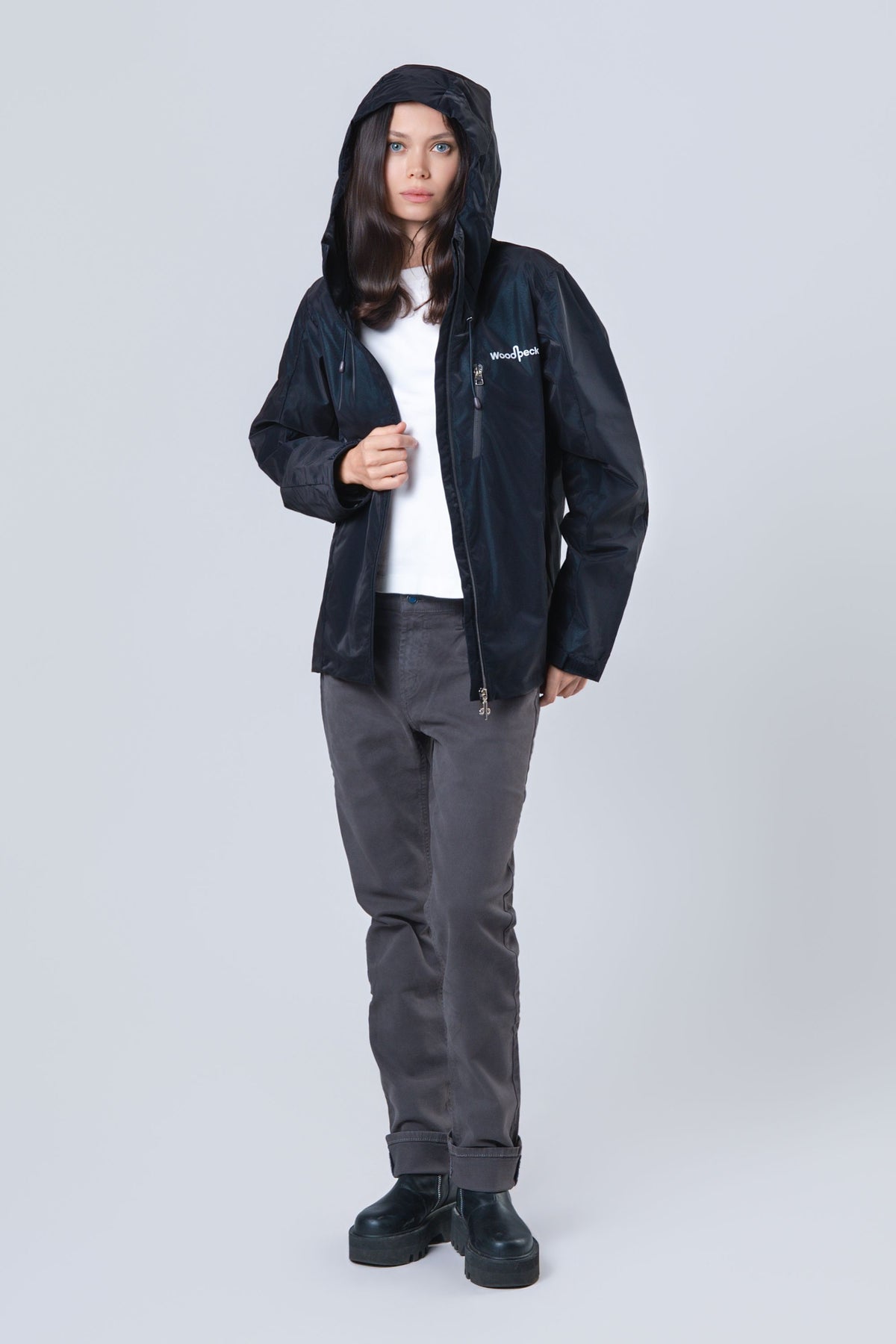 Woman wearing the wind shell windbreaker jacket in Blue Diamond