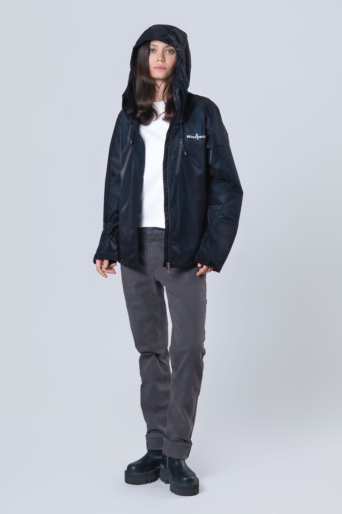 Woman wearing the wind shell windbreaker jacket in Blue Diamond