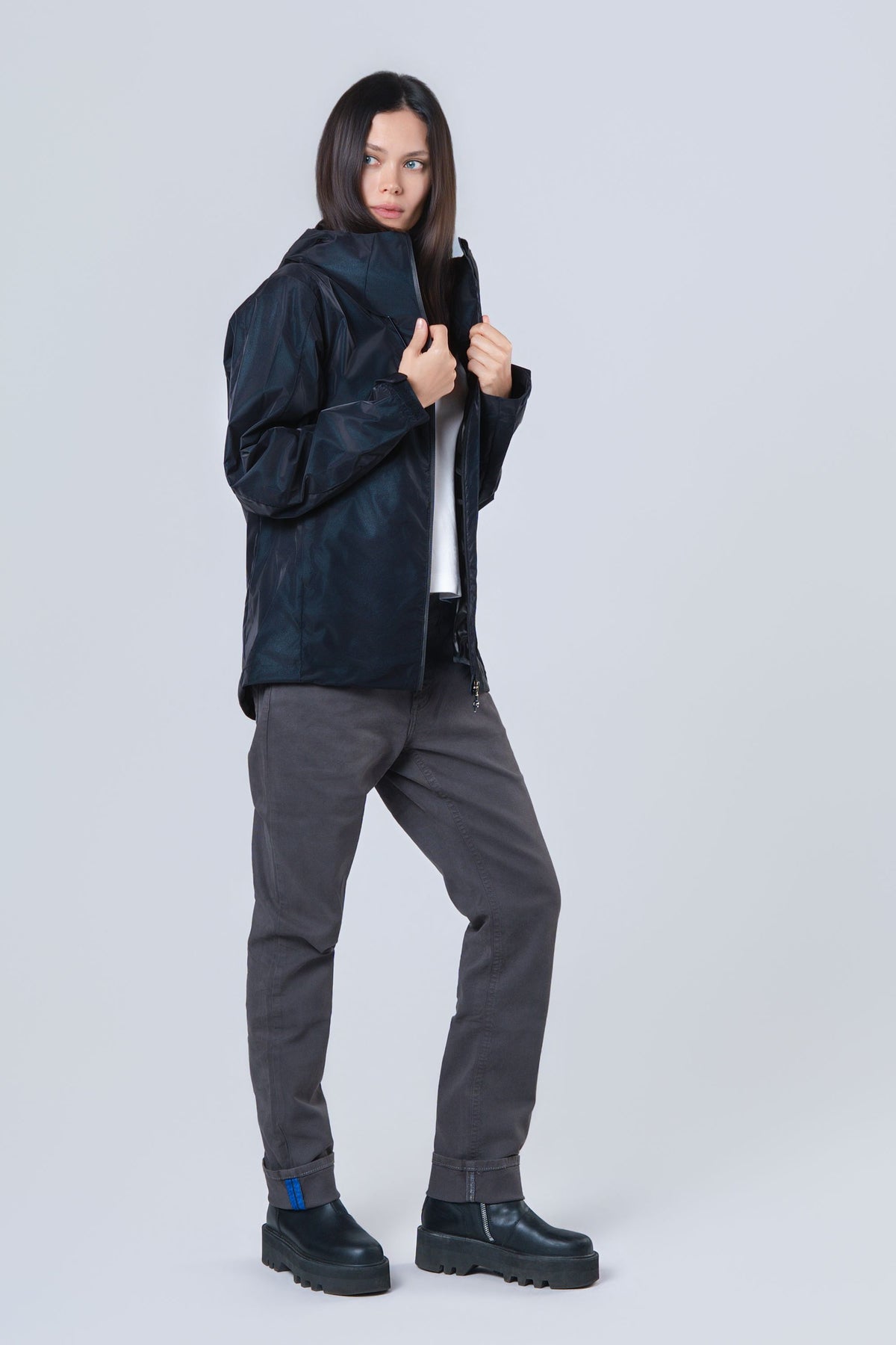 Woman wearing the wind shell windbreaker jacket in Blue Diamond