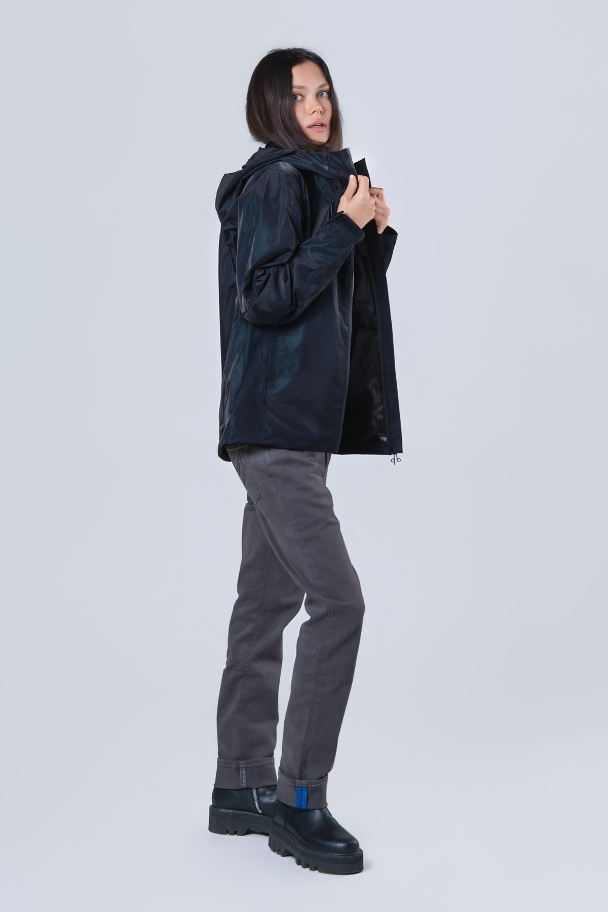 Woman wearing the wind shell windbreaker jacket in Blue Diamond