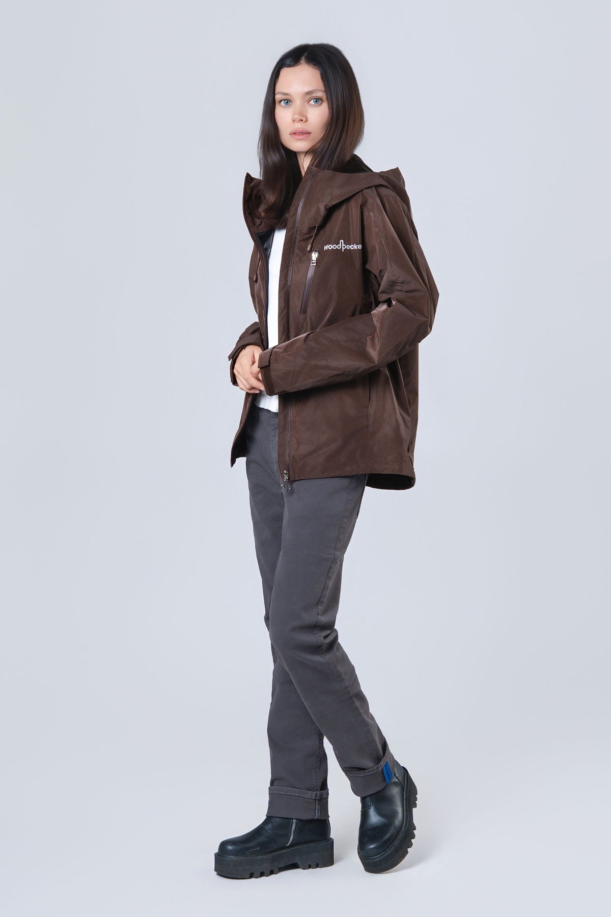 Woman wearing the wind shell windbreaker jacket in Mocha Diamond