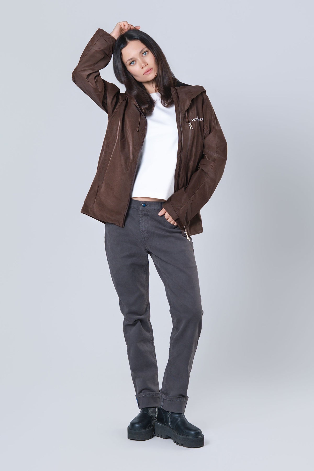 Woman wearing the wind shell windbreaker jacket in Mocha Diamond