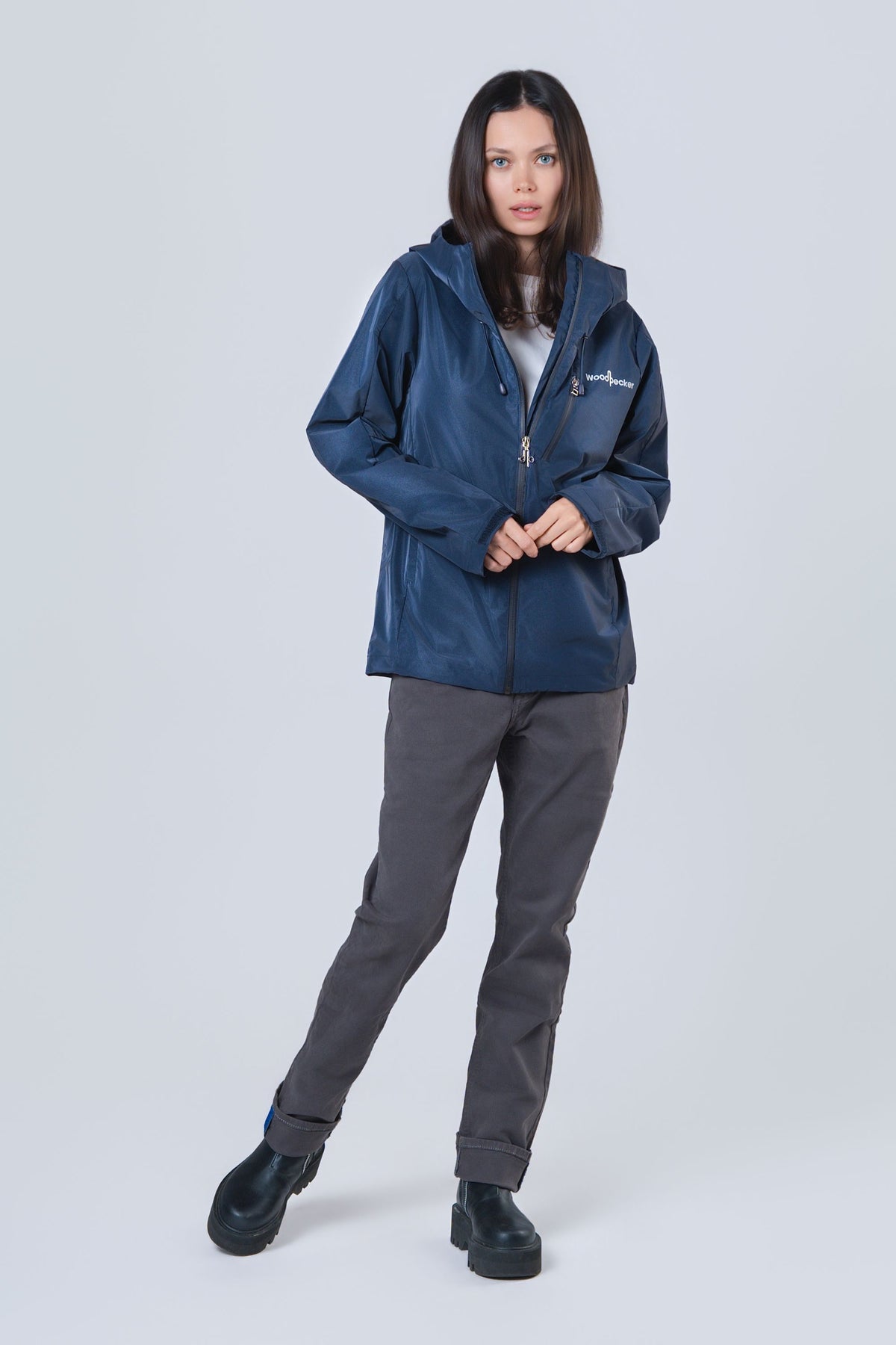 Woman wearing the wind shell windbreaker jacket in Sapphire Diamond
