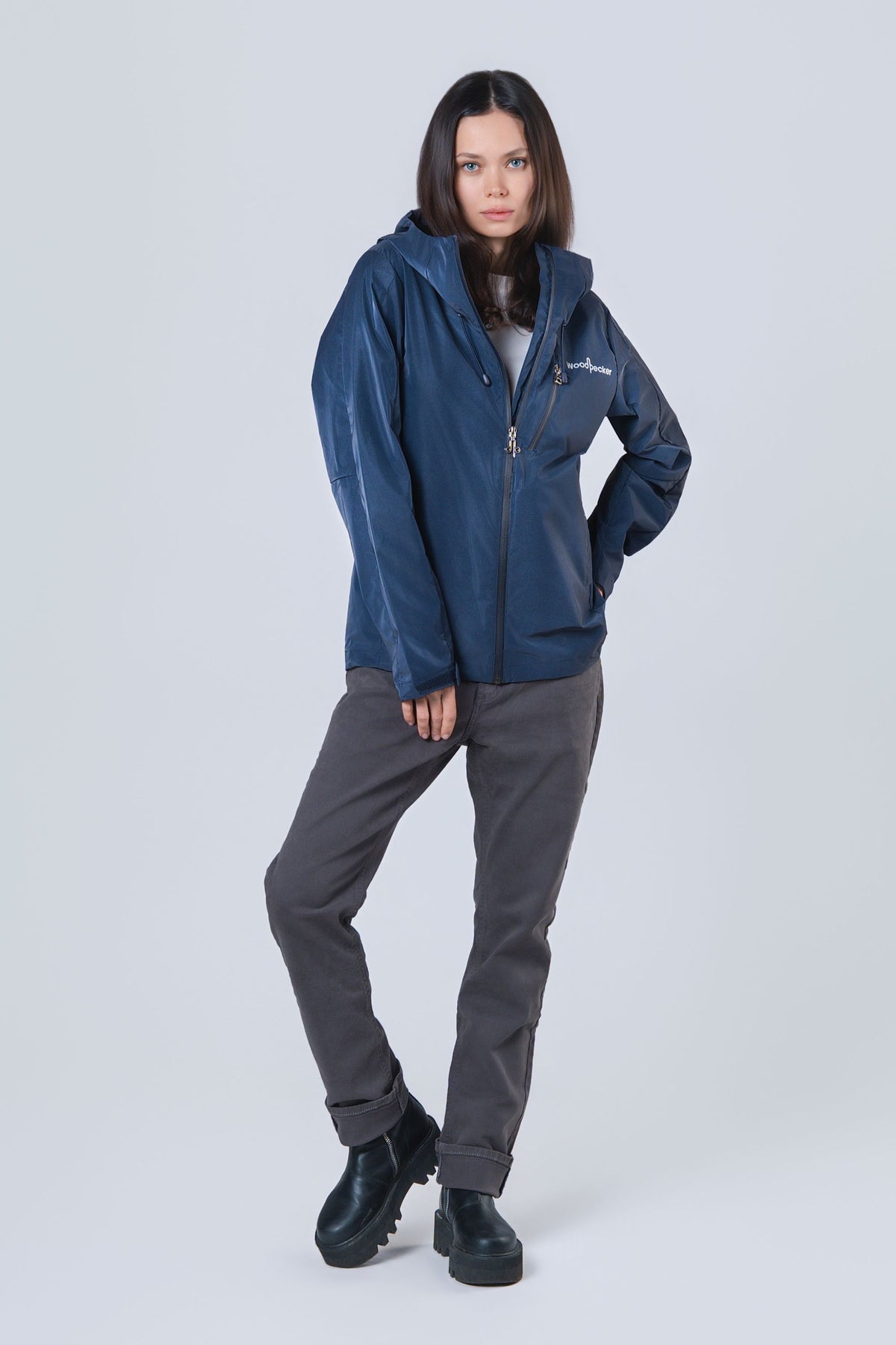 Woman wearing the wind shell windbreaker jacket in Sapphire Diamond