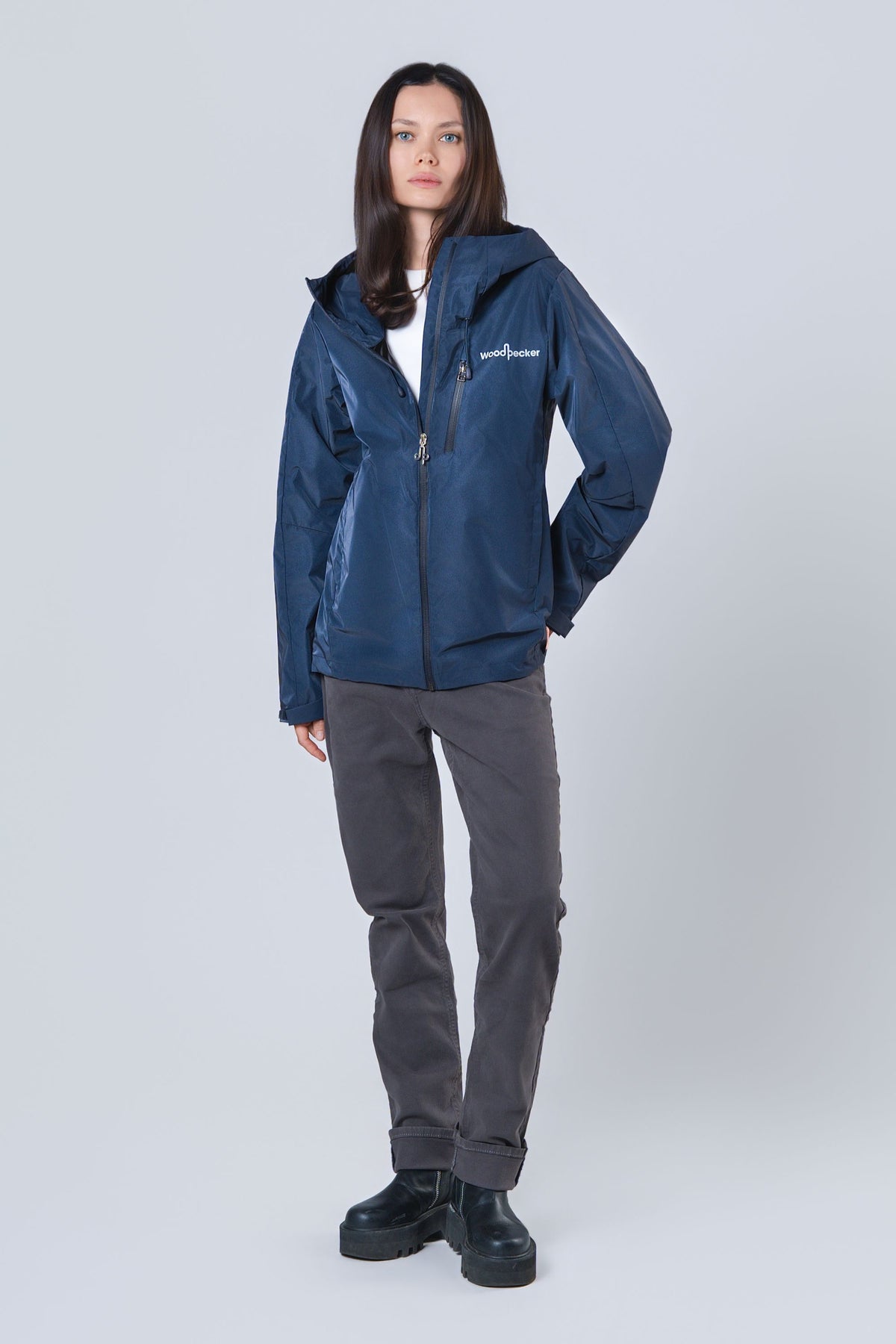 Woman wearing the wind shell windbreaker jacket in Sapphire Diamond