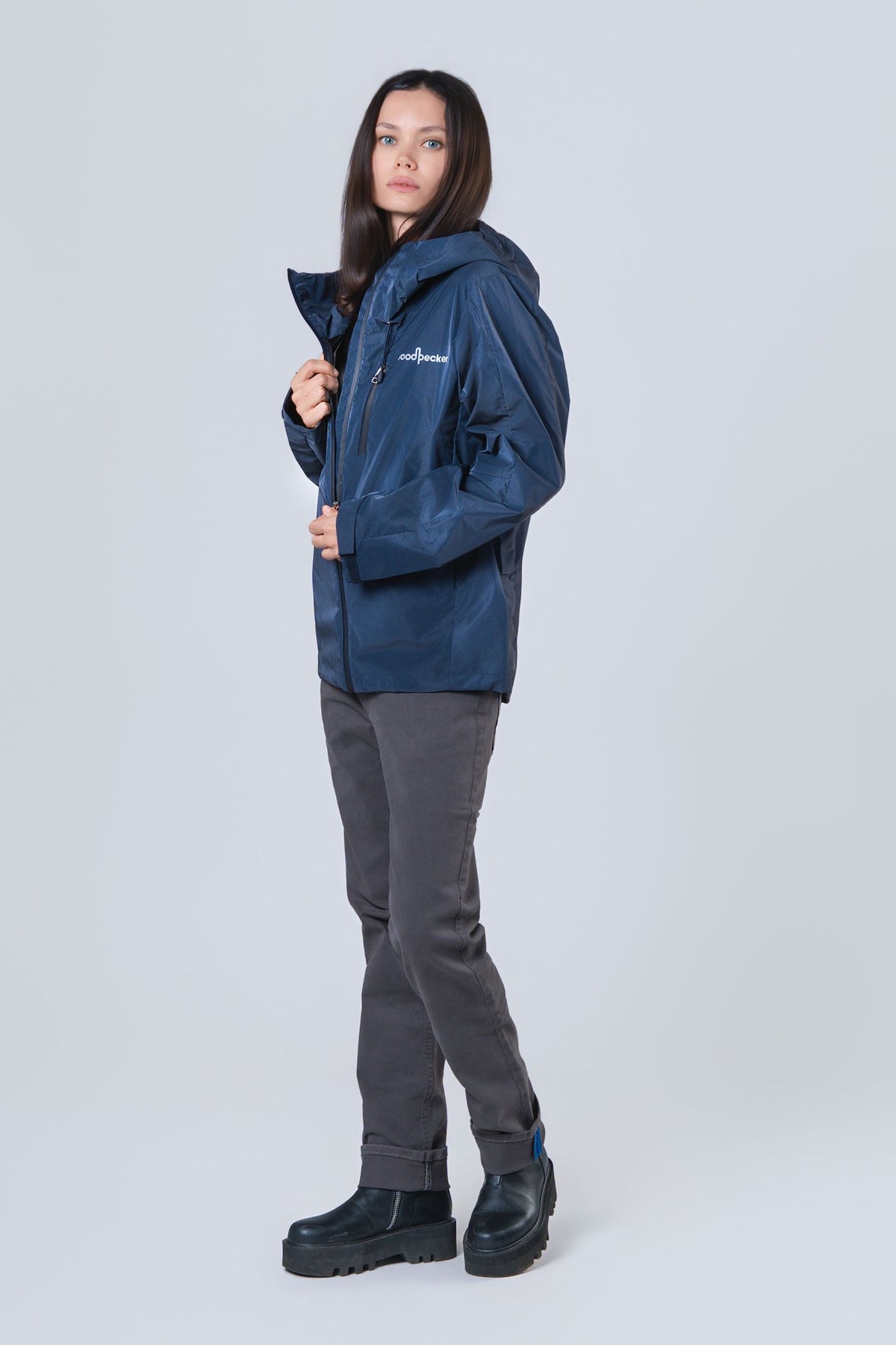 Woman wearing the wind shell windbreaker jacket in Sapphire Diamond