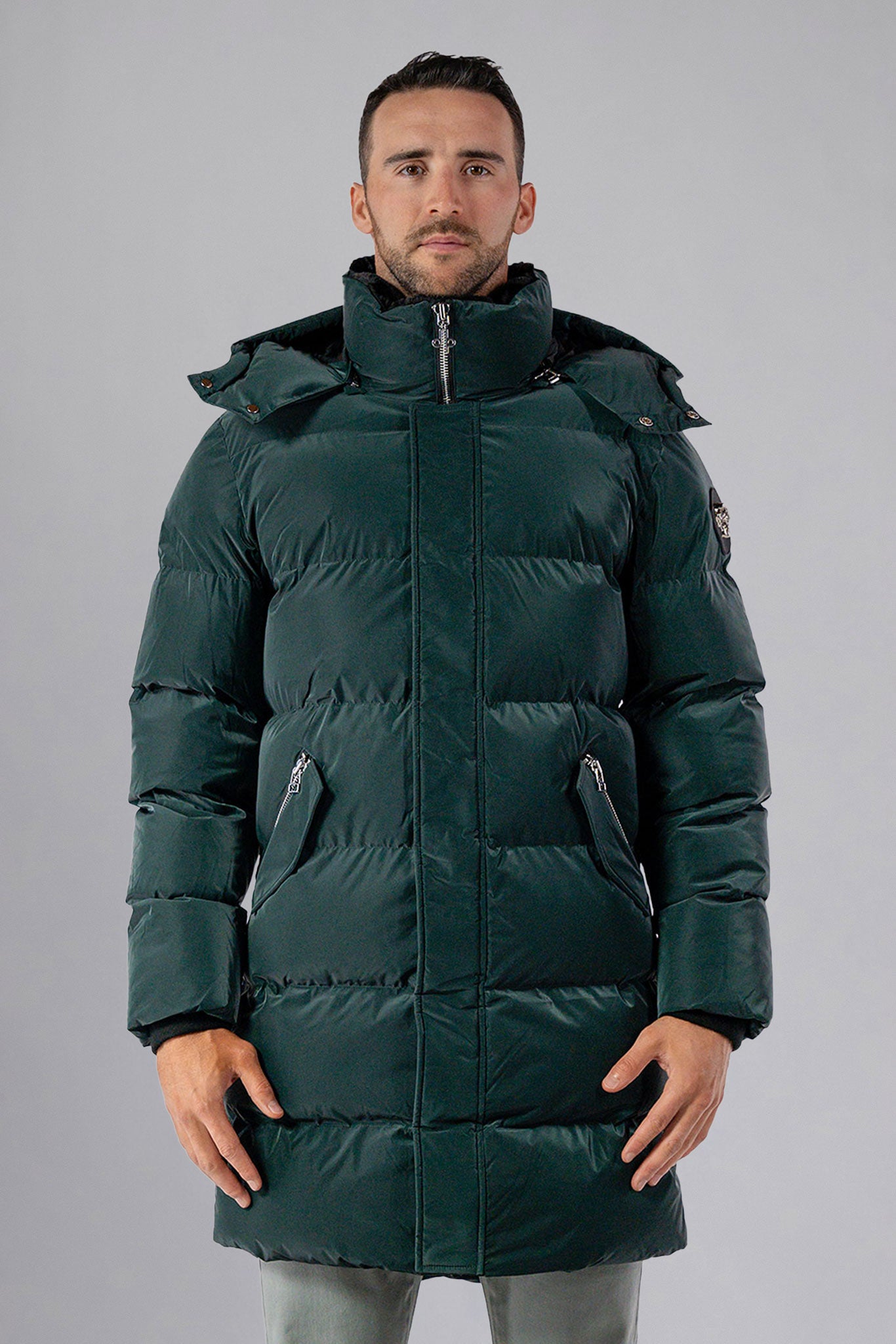 Woodpecker Men's Penguin Long Winter coat. High-end Canadian designer winter coat for men in "Green Diamond" navy blue colour. Woodpecker cruelty-free winter coat designed in Canada. Men's heavy weight long length premium designer jacket for winter. Superior quality warm winter coat for men. Moose Knuckles, Canada Goose, Mackage, Montcler, Will Poho, Willbird, Nic Bayley