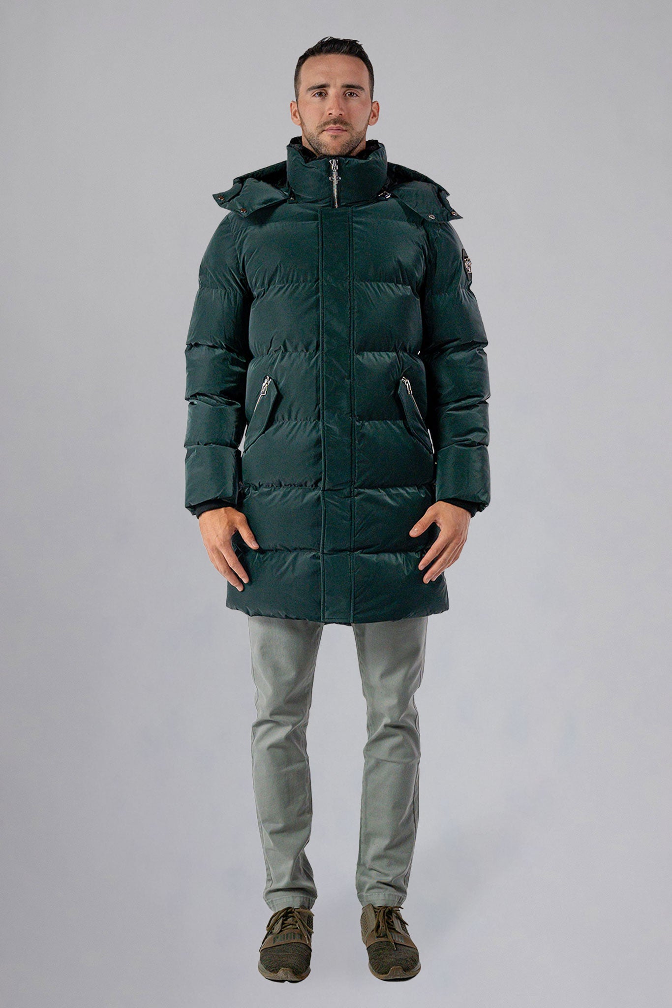 Woodpecker Men&#39;s Penguin Long Winter coat. High-end Canadian designer winter coat for men in &quot;Green Diamond&quot; navy blue colour. Woodpecker cruelty-free winter coat designed in Canada. Men&#39;s heavy weight long length premium designer jacket for winter. Superior quality warm winter coat for men. Moose Knuckles, Canada Goose, Mackage, Montcler, Will Poho, Willbird, Nic Bayley