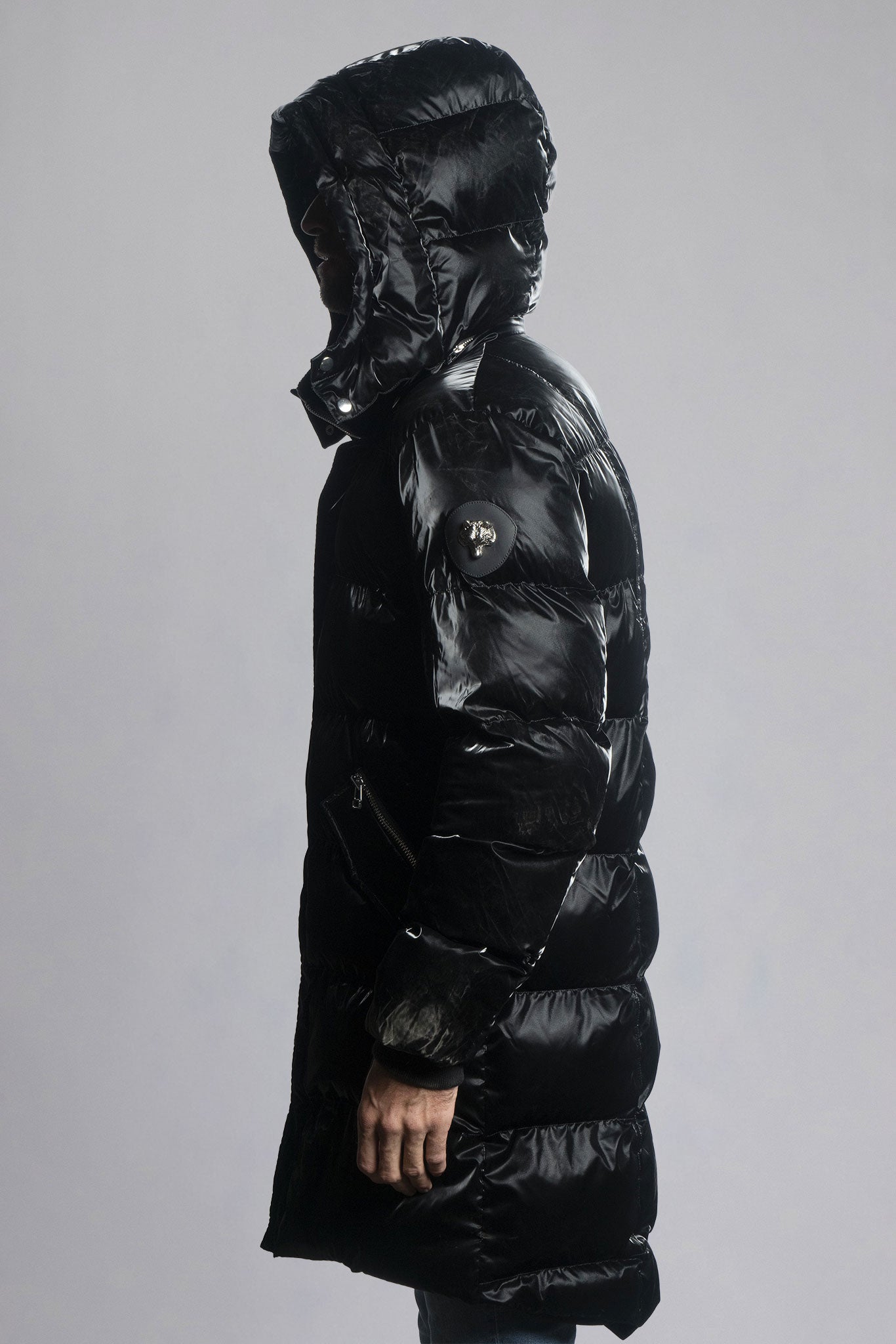 Woodpecker Men's Penguin Long Winter coat. High-end Canadian designer winter coat for men in shiny "All Wet Black" colour. Woodpecker cruelty-free winter coat designed in Canada. Men's heavy weight long length premium designer jacket for winter. Superior quality warm winter coat for men. Moose Knuckles, Canada Goose, Mackage, Montcler, Will Poho, Willbird, Nic Bayley