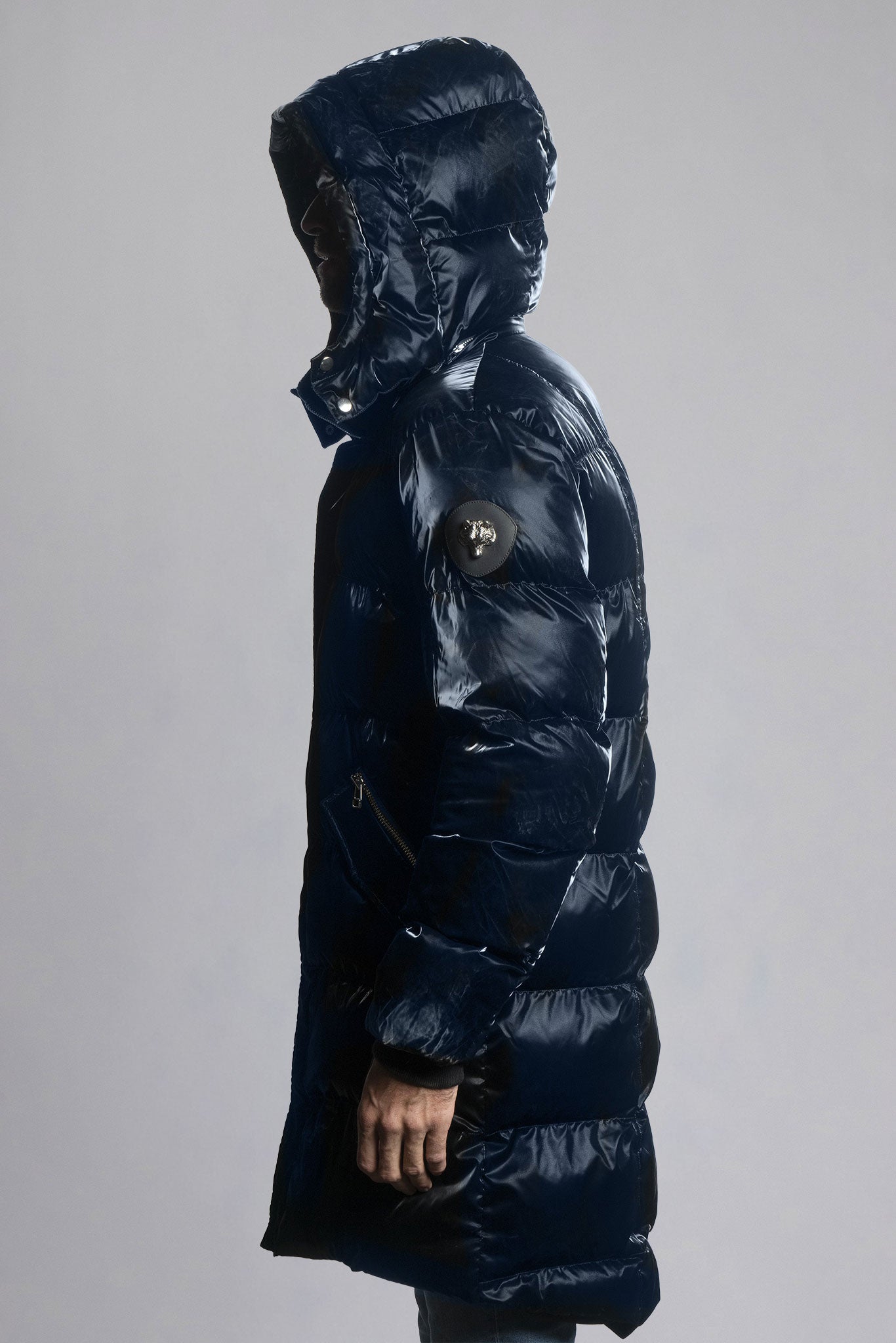 Woodpecker Men's Penguin Long Winter coat. High-end Canadian designer winter coat for men in shiny "All Wet Blue" navy blue colour. Woodpecker cruelty-free winter coat designed in Canada. Men's heavy weight long length premium designer jacket for winter. Superior quality warm winter coat for men. Moose Knuckles, Canada Goose, Mackage, Montcler, Will Poho, Willbird, Nic Bayley