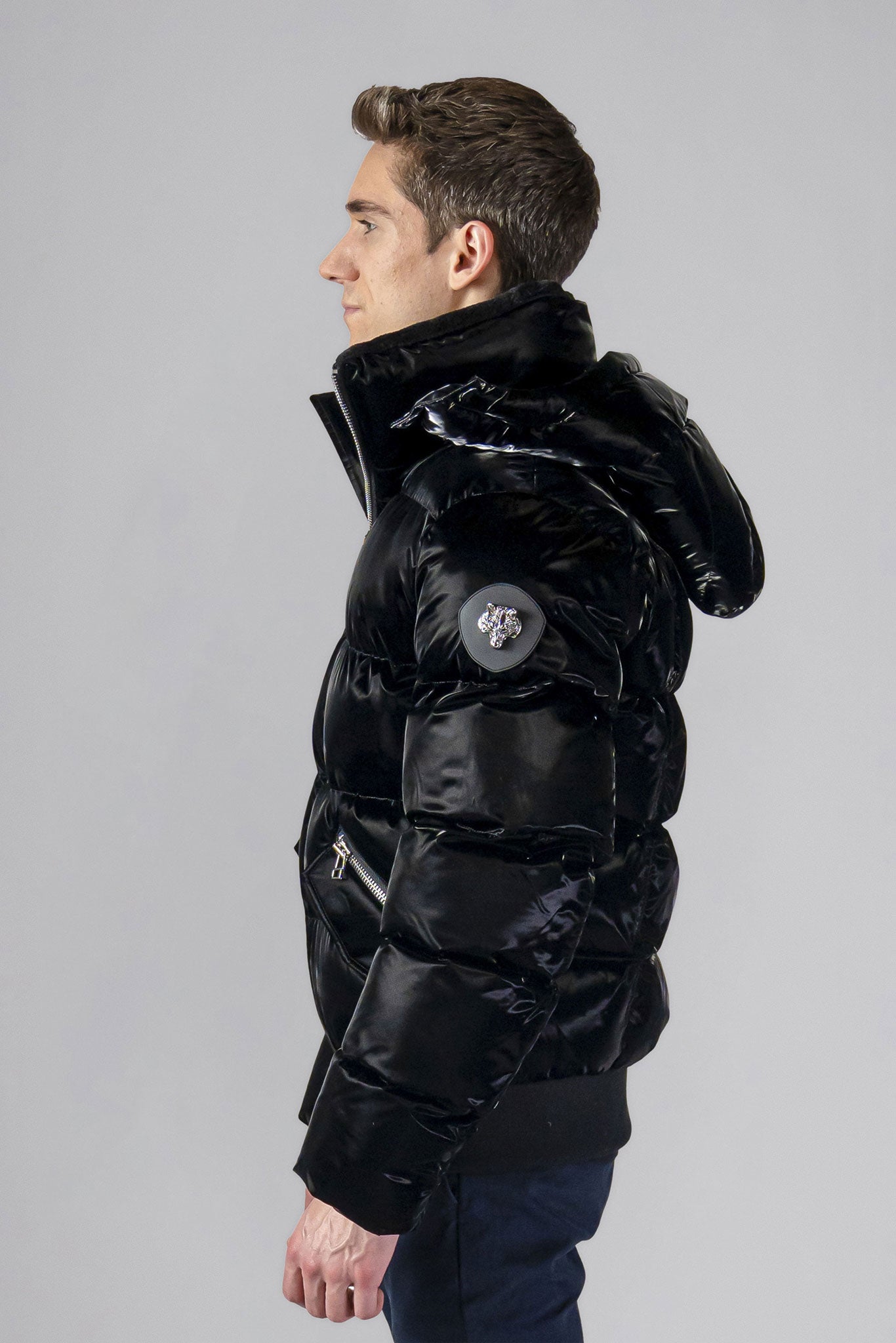 Woodpecker Men&#39;s Woody Bomber Winter coat. High-end Canadian designer winter coat for men in shiny “All Wet Black&quot; colour. Woodpecker cruelty-free winter coat designed in Canada. Men&#39;s heavy weight short length premium designer jacket for winter. Superior quality warm winter coat for men. Moose Knuckles, Canada Goose, Mackage, Montcler, Will Poho, Willbird, Nic Bayley. Shiny parka. Stylish winter jacket. Designer winter coat.