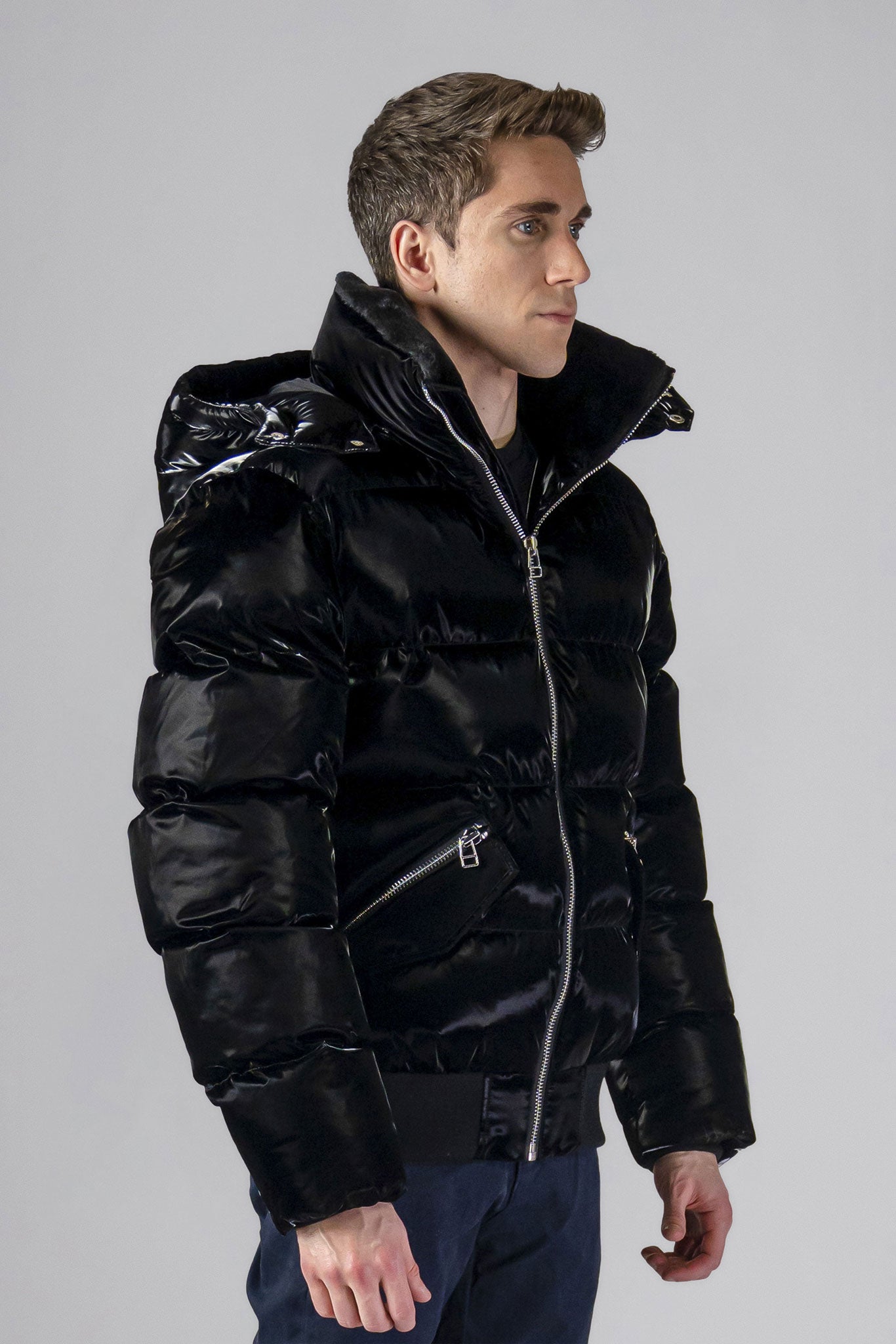 Woodpecker Men&#39;s Woody Bomber Winter coat. High-end Canadian designer winter coat for men in shiny “All Wet Black&quot; colour. Woodpecker cruelty-free winter coat designed in Canada. Men&#39;s heavy weight short length premium designer jacket for winter. Superior quality warm winter coat for men. Moose Knuckles, Canada Goose, Mackage, Montcler, Will Poho, Willbird, Nic Bayley. Shiny parka. Stylish winter jacket. Designer winter coat.