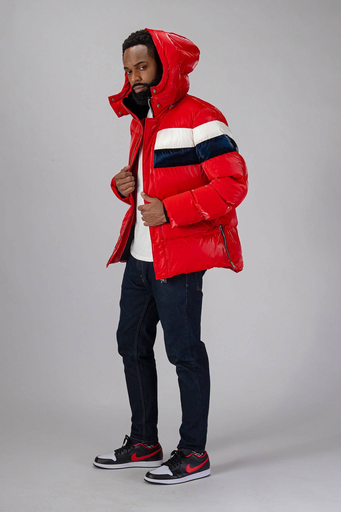 High-end Canadian designer winter coat for men in "Red White Blue" colour. Woodpecker cruelty-free winter coat designed in Canada. Men's heavy weight medium length premium designer jacket for winter. Superior quality warm winter coat for men. Moose Knuckles, Canada Goose, Mackage, Montcler, Will Poho, Willbird, Nic Bayley. Shiny parka. Stylish winter jacket. Designer winter coat.