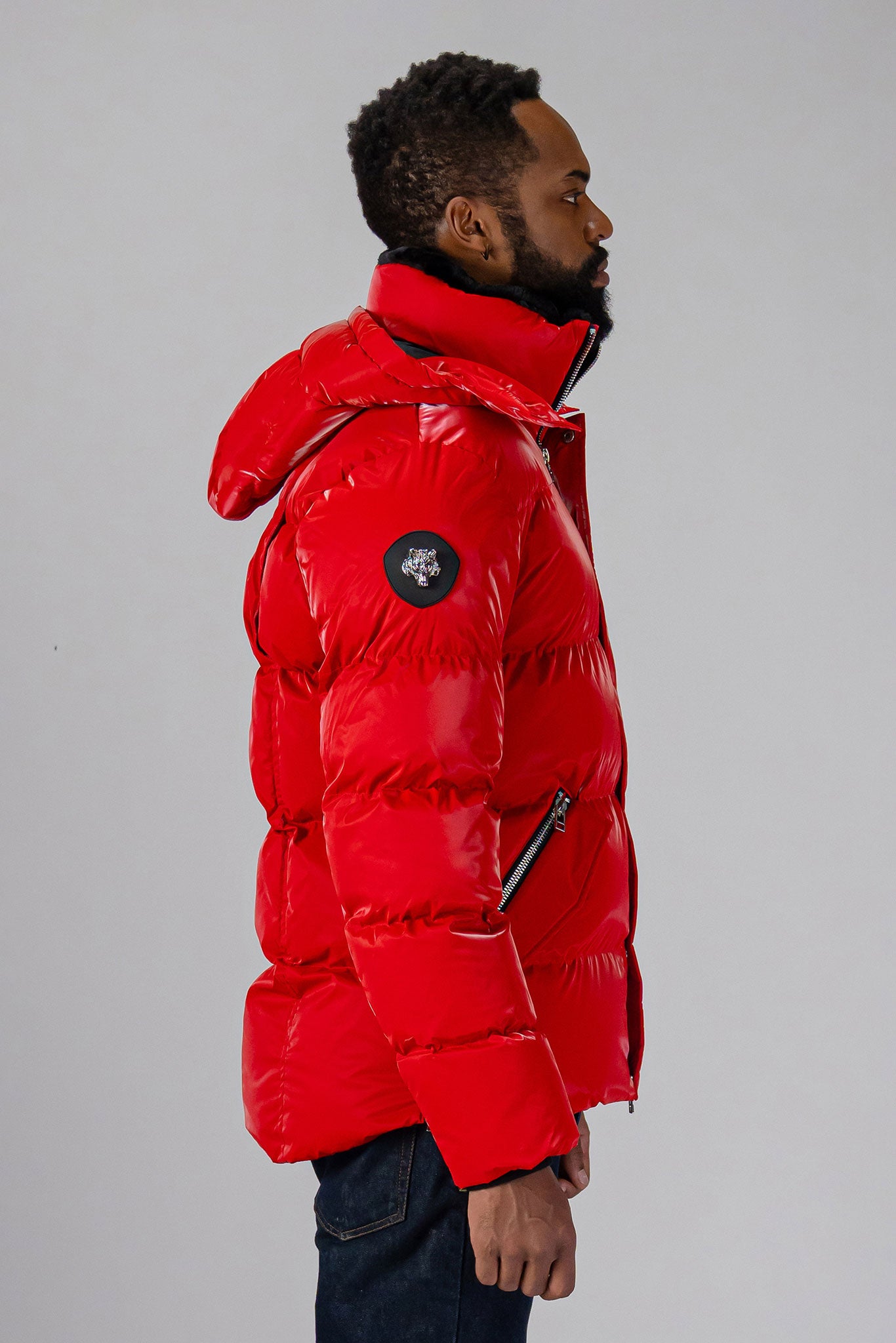 High-end Canadian designer winter coat for men in "Red White Blue" colour. Woodpecker cruelty-free winter coat designed in Canada. Men's heavy weight medium length premium designer jacket for winter. Superior quality warm winter coat for men. Moose Knuckles, Canada Goose, Mackage, Montcler, Will Poho, Willbird, Nic Bayley. Shiny parka. Stylish winter jacket. Designer winter coat.