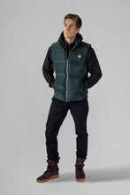 Load image into Gallery viewer, Woodpecker Unisex Winter Vest. High-end Canadian designer winter vest in &quot;Green Diamond&quot; colour. Woodpecker cruelty-free vest designed in Canada. Heavy weight short length premium designer vest for winter. Superior quality warm winter vest. Moose Knuckles, Canada Goose, Mackage, Montcler, Will Poho, Willbird, Nic Bayley. Extra warm. Shiny vest. Stylish winter vest. Designer winter vest.
