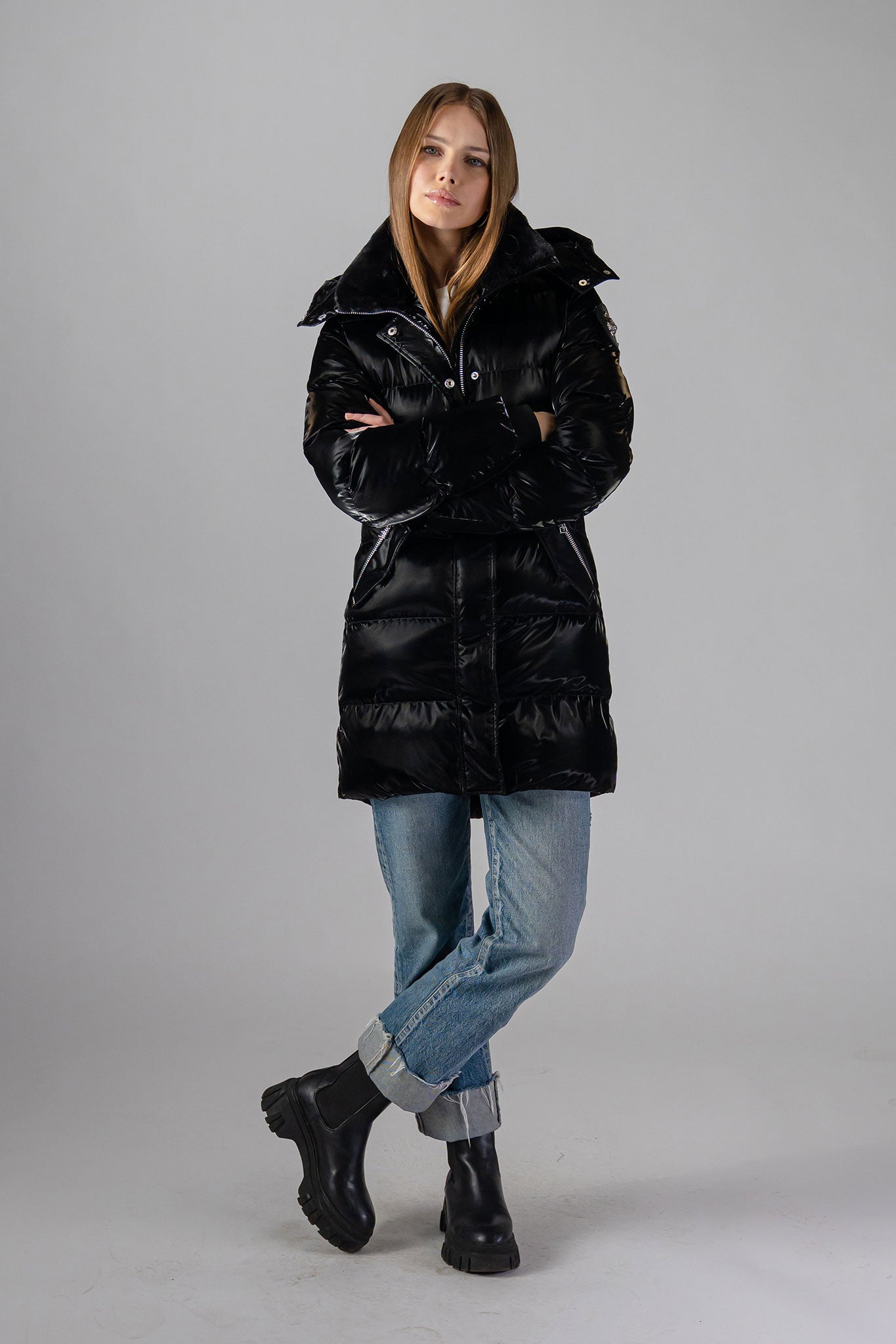 Woodpecker Women&#39;s Penguin Long Winter coat. High-end Canadian designer winter coat for women in &quot;All Wet Black&quot; colour. Woodpecker cruelty-free winter coat designed in Canada. Women&#39;s heavy weight long length premium designer jacket for winter. Superior quality warm winter coat for women. Moose Knuckles, Canada Goose, Mackage, Montcler, Will Poho, Willbird, Nic Bayley. Extra warm. Shiny parka. Stylish winter jacket. Designer winter coat.