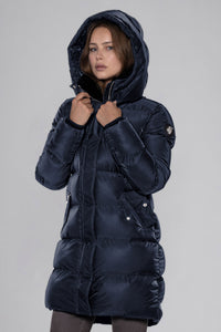 Woodpecker Women's Penguin Long Winter coat. High-end Canadian designer winter coat for women in "Blue Diamond" colour. Woodpecker cruelty-free winter coat designed in Canada. Women's heavy weight long length premium designer jacket for winter. Superior quality warm winter coat for women. Moose Knuckles, Canada Goose, Mackage, Montcler, Will Poho, Willbird, Nic Bayley. Extra warm. Shiny parka. Stylish winter jacket. Designer winter coat.