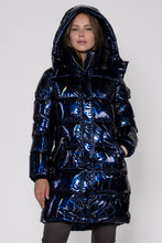 Load image into Gallery viewer, Woodpecker Women&#39;s Penguin Long Winter coat. High-end Canadian designer winter coat for women in &quot;Oily Blue&quot; colour. Woodpecker cruelty-free winter coat designed in Canada. Women&#39;s heavy weight long length premium designer jacket for winter. Superior quality warm winter coat for women. Moose Knuckles, Canada Goose, Mackage, Montcler, Will Poho, Willbird, Nic Bayley. Extra warm. Shiny parka. Stylish winter jacket. Designer winter coat.
